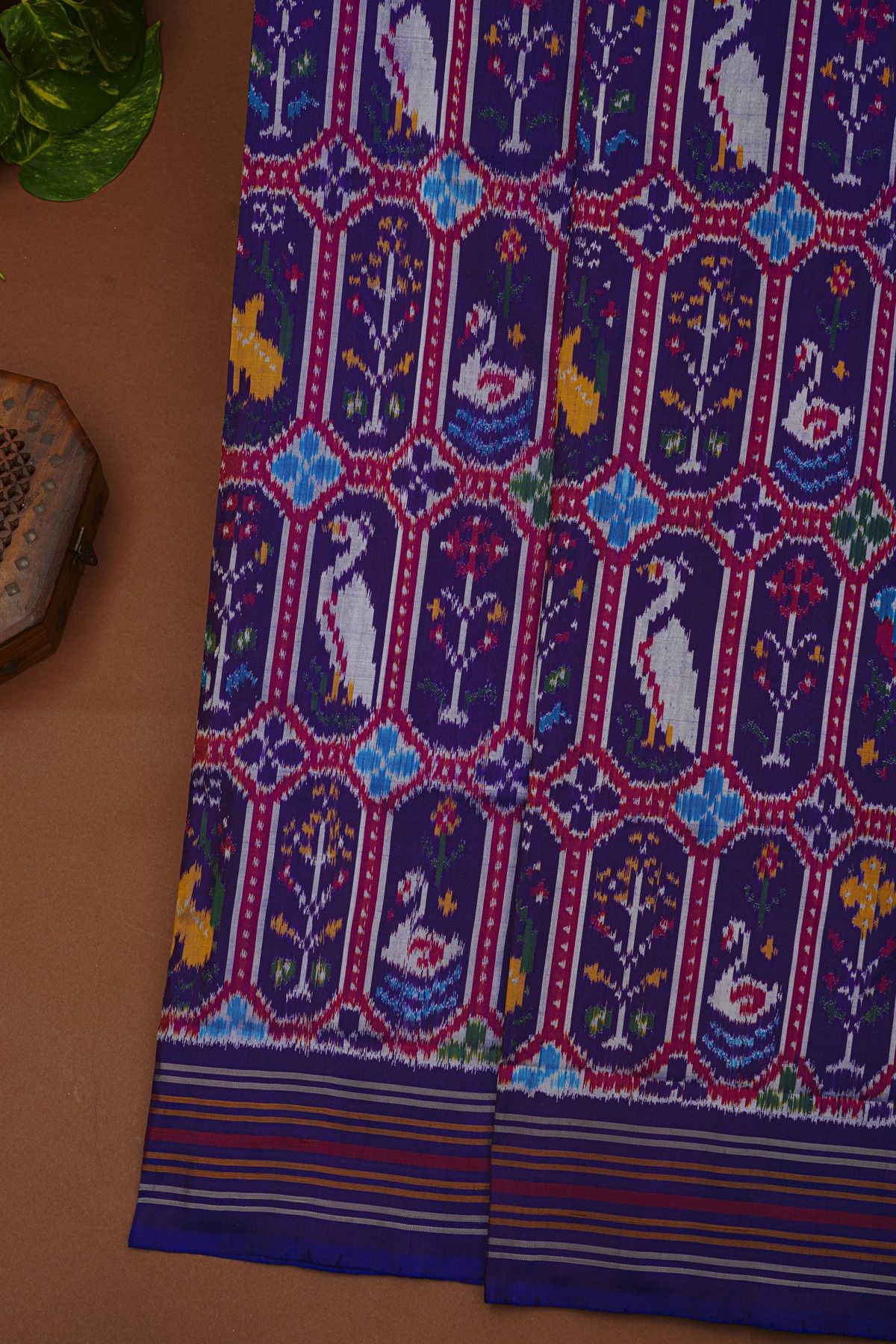 Ikat Silk Navy Blue Saree With Florals And Swans In Ikat Design Body