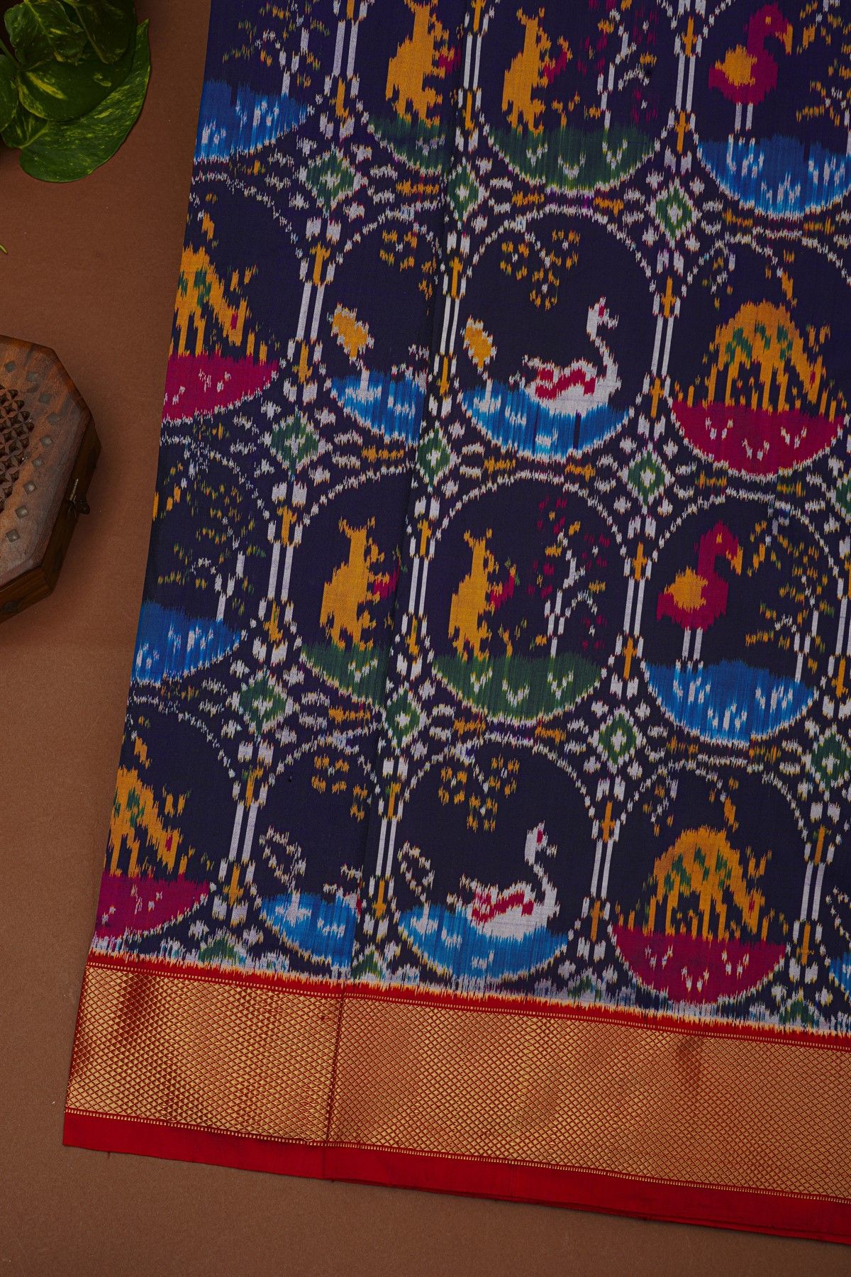 Ikat Silk Navy Blue Saree With Florals And Animals In Circles Body