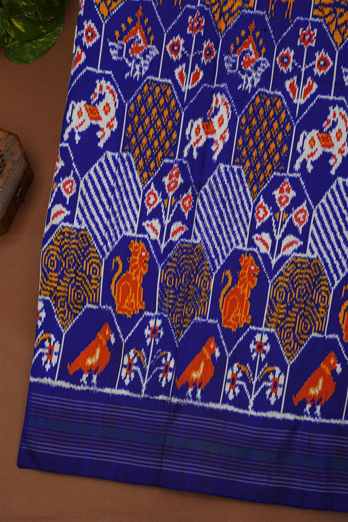 Ikat Silk Royal Blue Saree With Multicolor Floral Animal Motifs And Striped Border