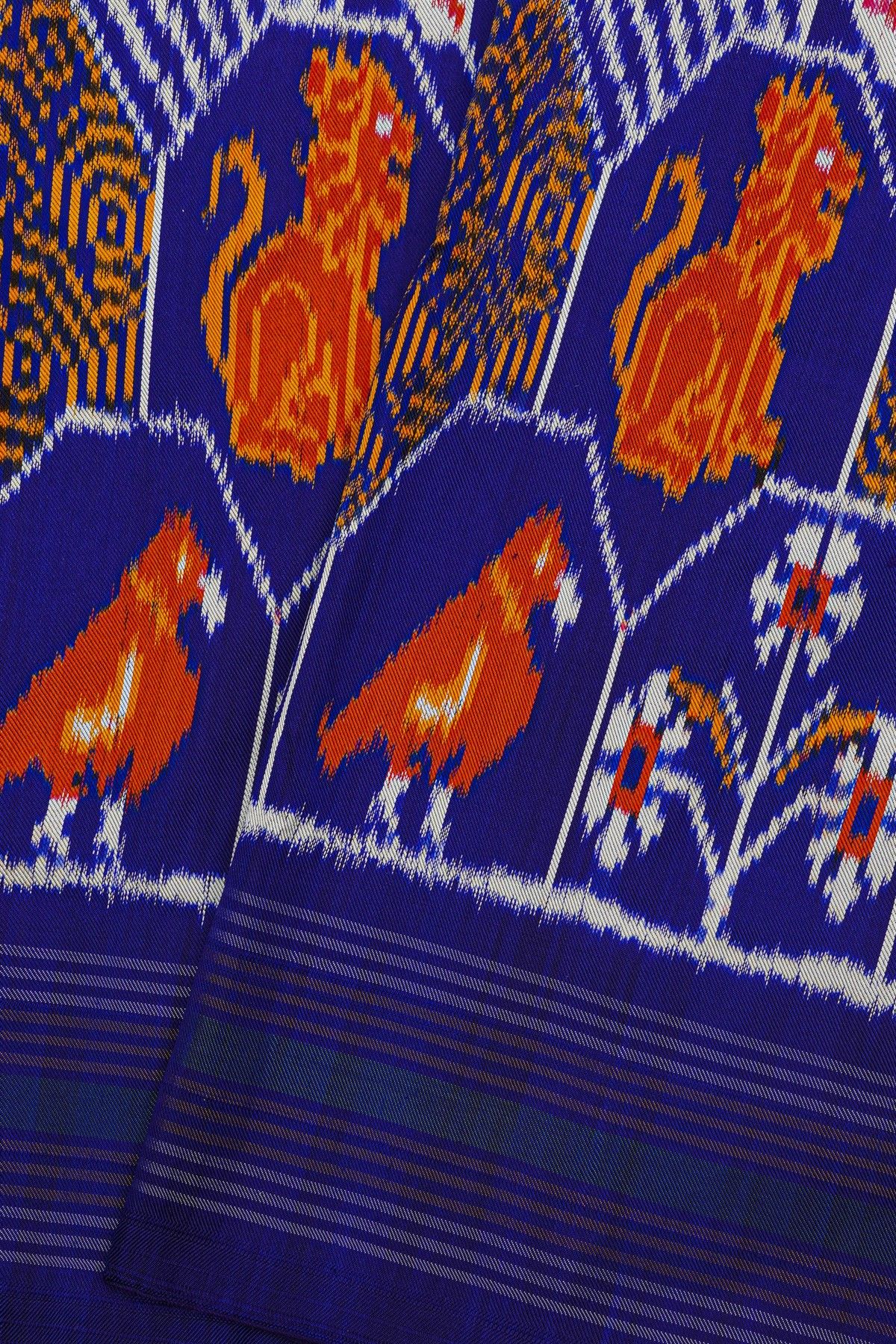 Ikat Silk Royal Blue Saree With Multicolor Floral Animal Motifs And Striped Border