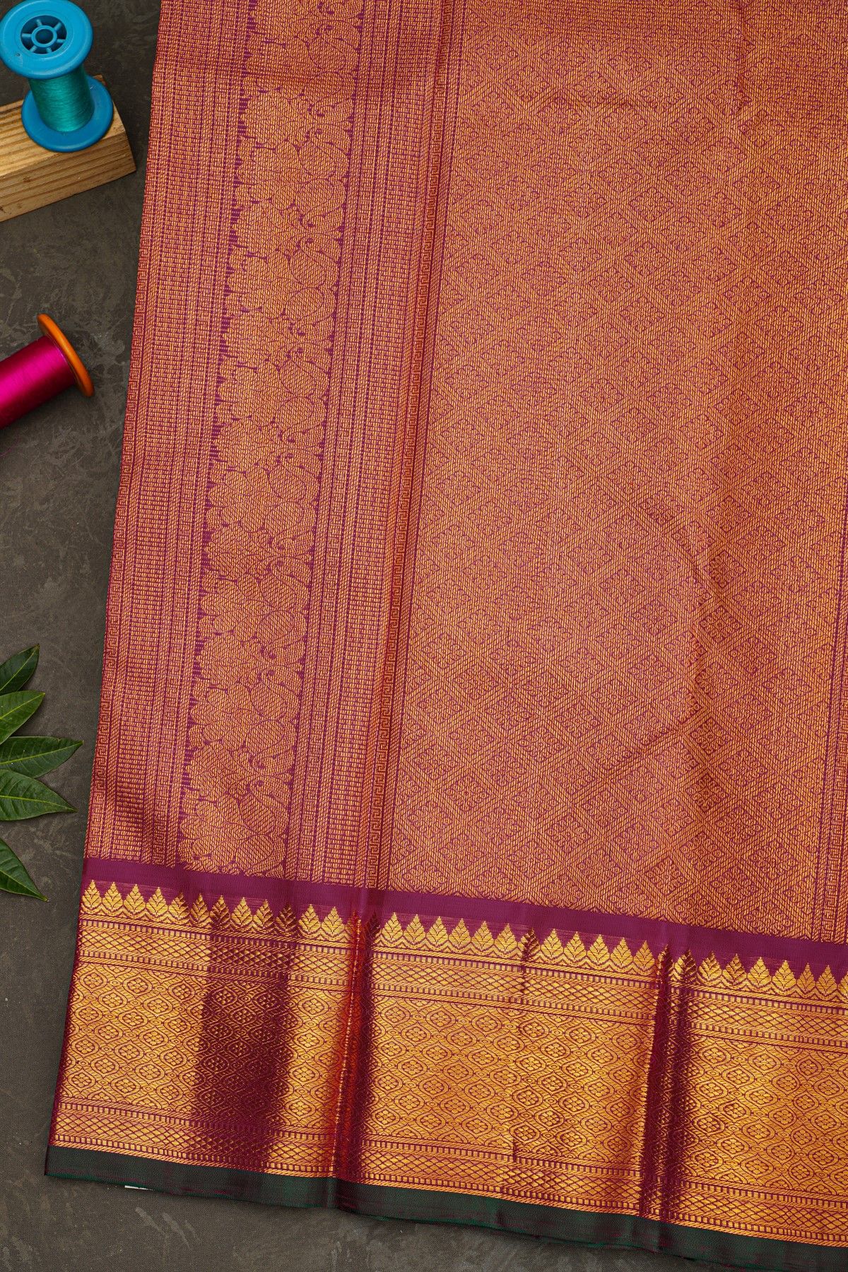 Kancheepuram Silk Rani Pink Saree With Zari Checks Floral And Peacock Buttis Body