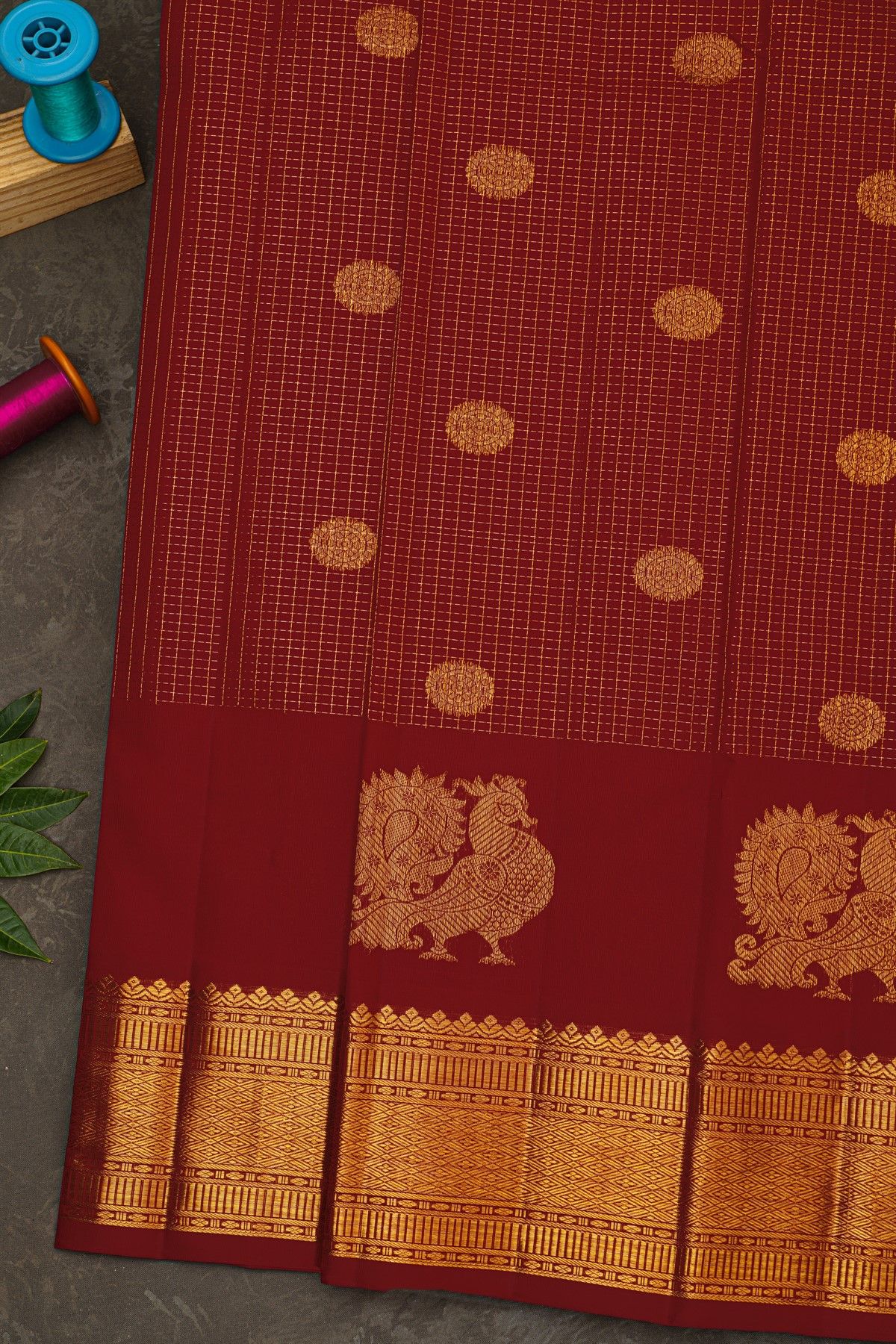 Kancheepuram Silk Red Saree With Zari Checks Floral And Peacock Buttis Body