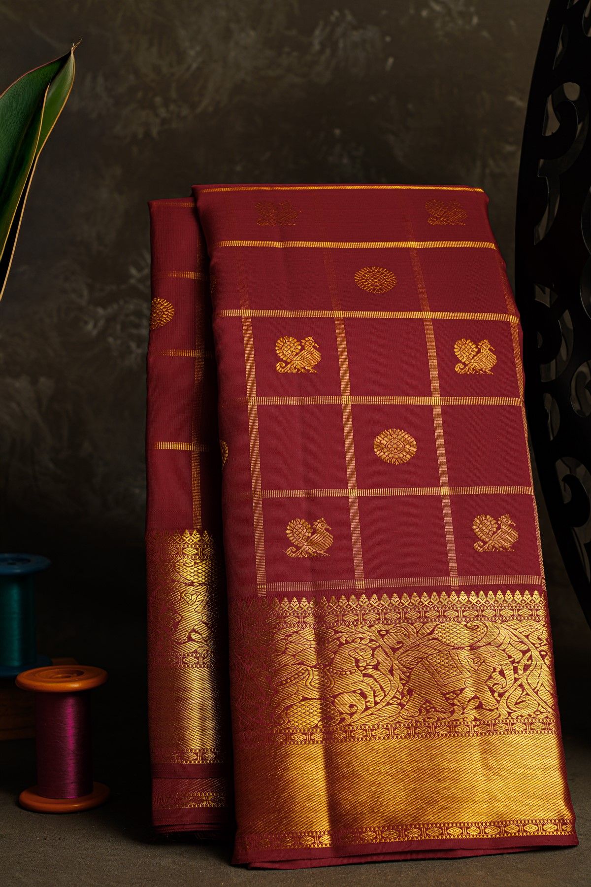 Kancheepuram Silk Dark Maroon Saree With Zari Checks Floral And Peacock Buttis Body