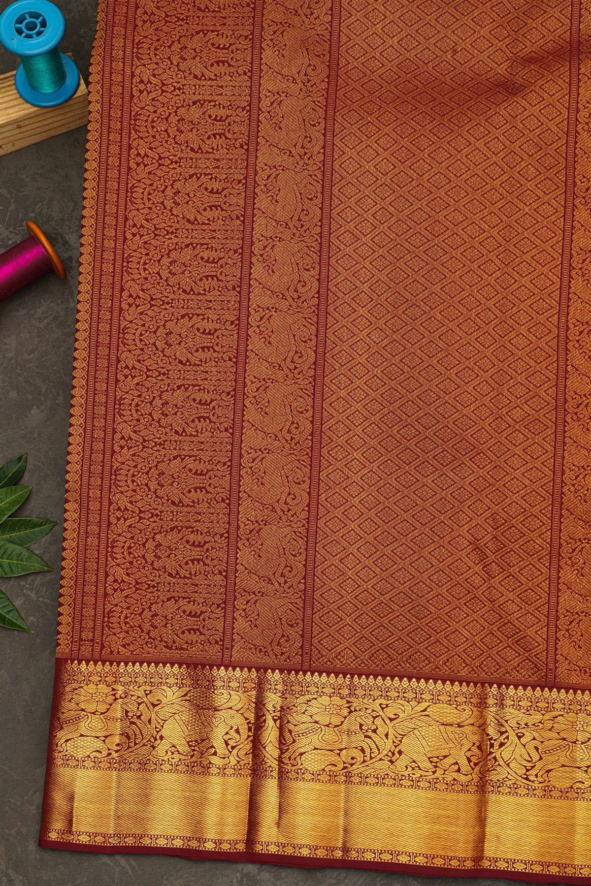 Kancheepuram Silk Dark Maroon Saree With Zari Checks Floral And Peacock Buttis Body