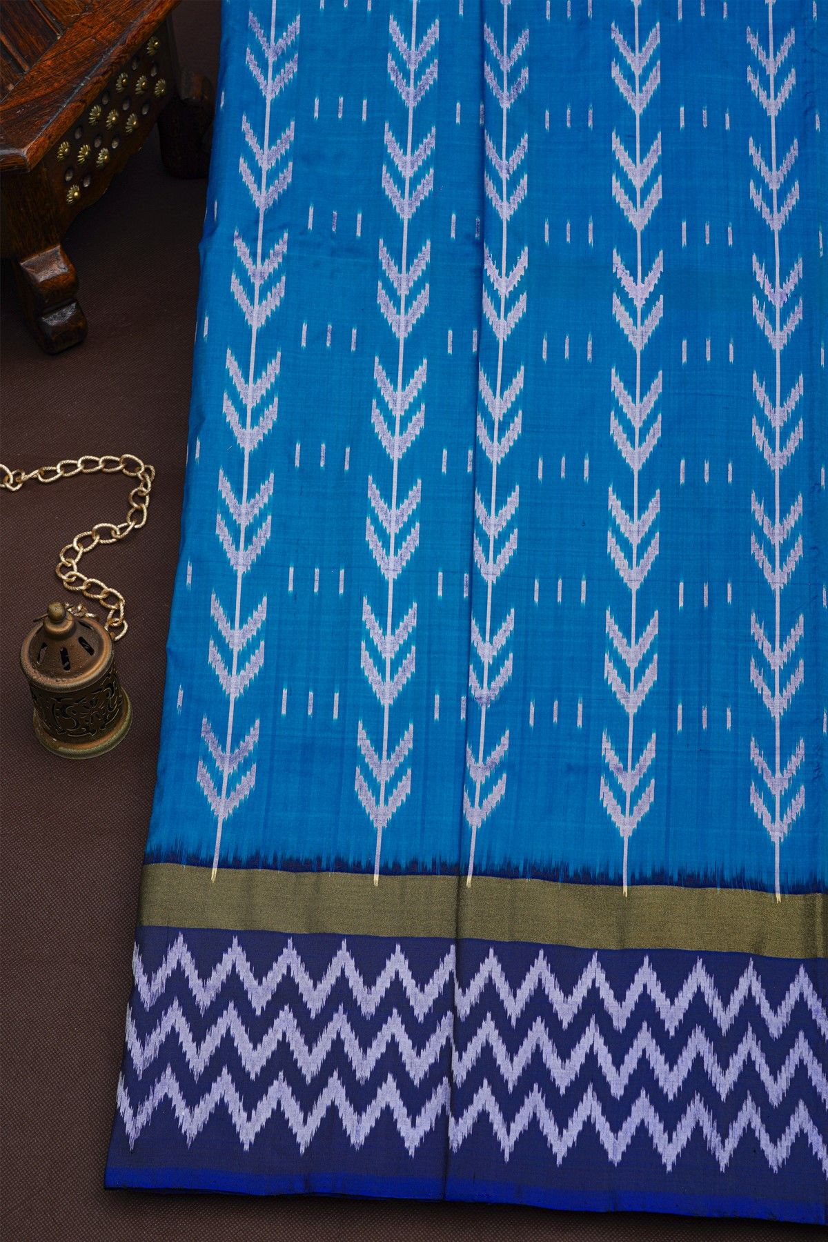 Pochampally Ikat Silk Sea Blue Saree With White Chevron Motifs And Zari Border