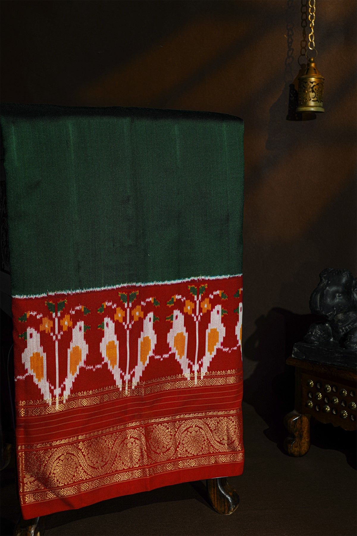 Pochampally Ikat Silk Bottle Green Saree With Florals And Parrots Border