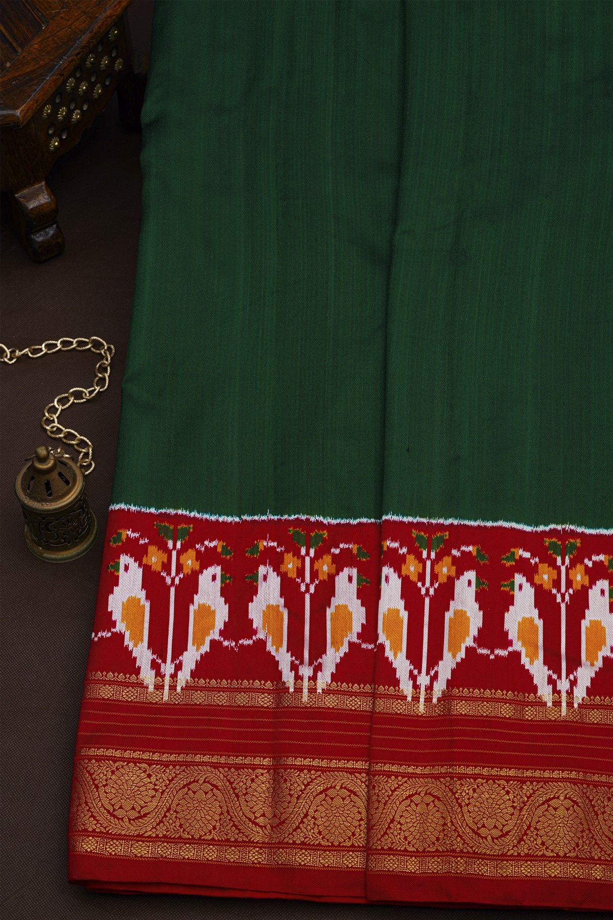 Pochampally Ikat Silk Bottle Green Saree With Florals And Parrots Border