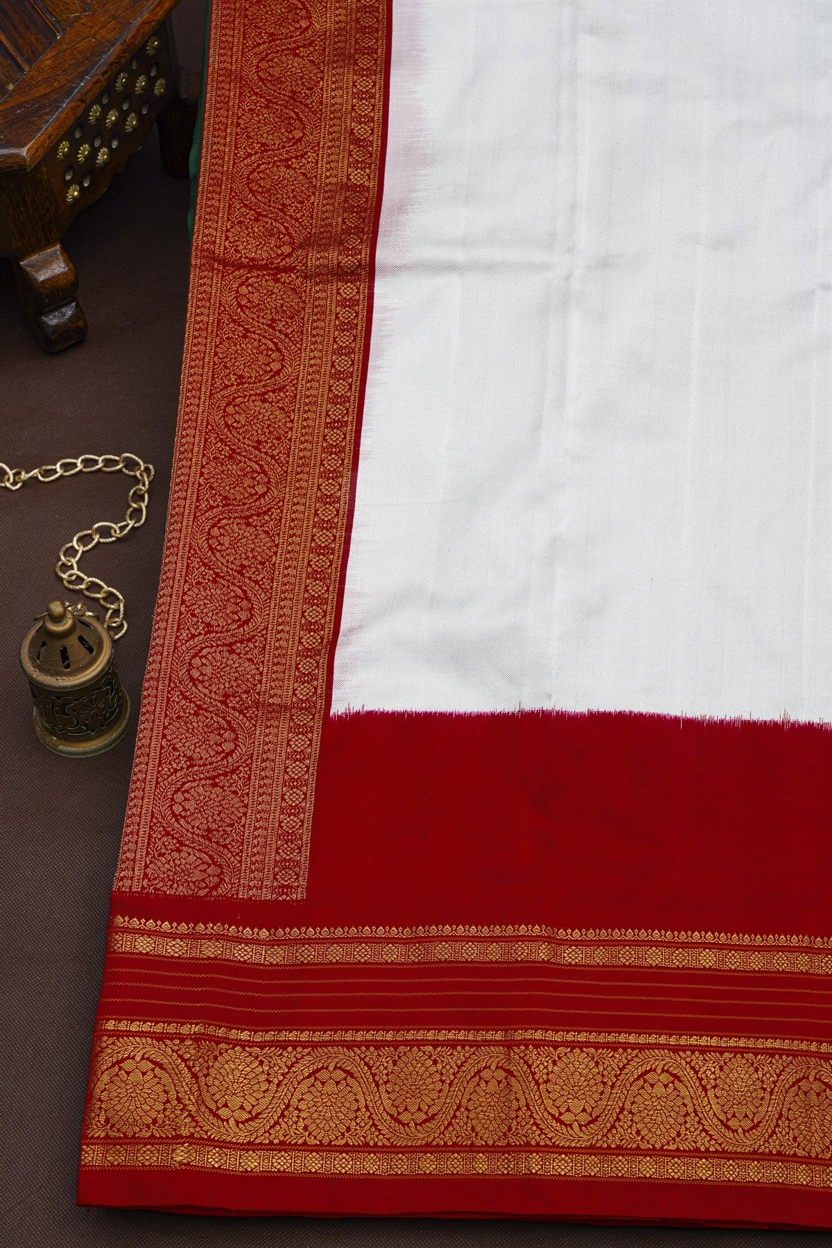 Pochampally Ikat Silk Bottle Green Saree With Florals And Parrots Border
