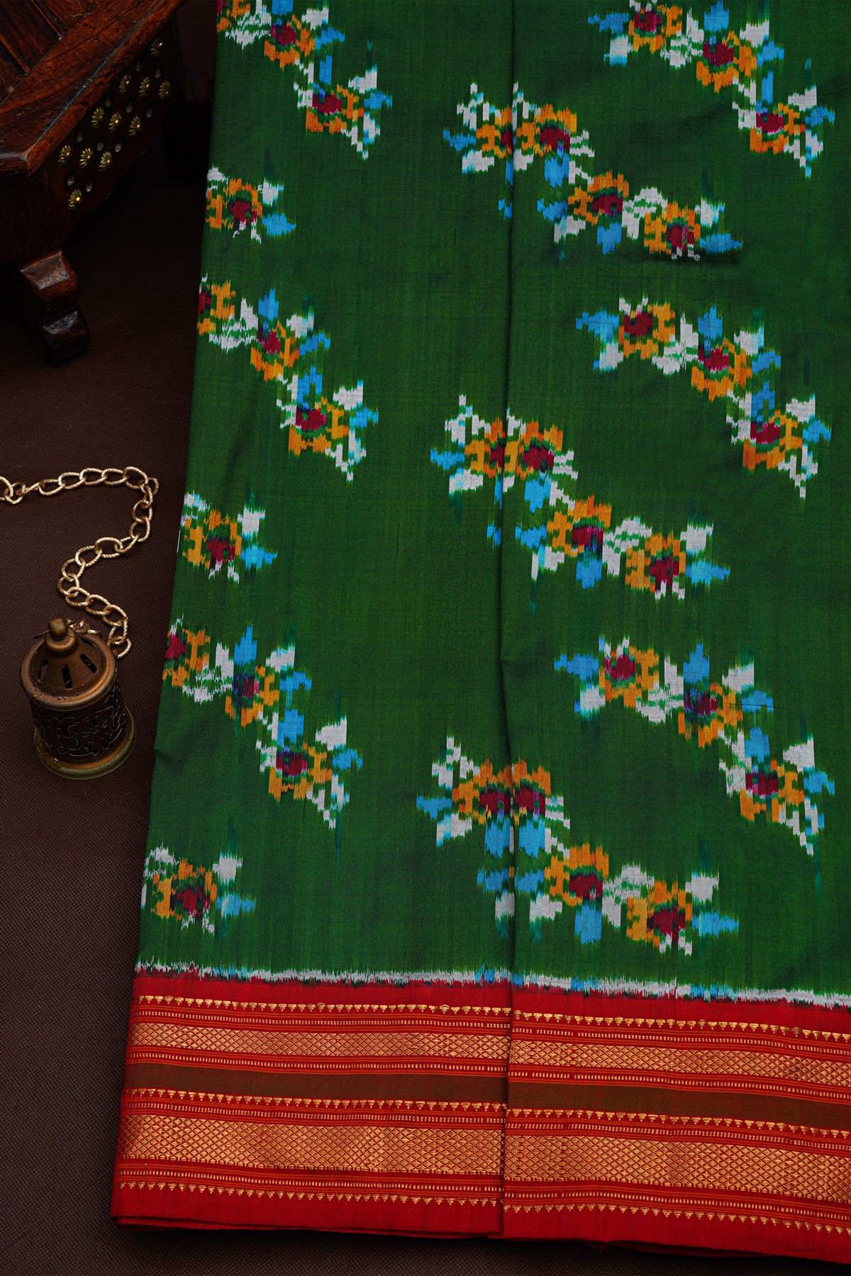 Ikat Silk Bottle Green Saree With Floral And Leaves Body
