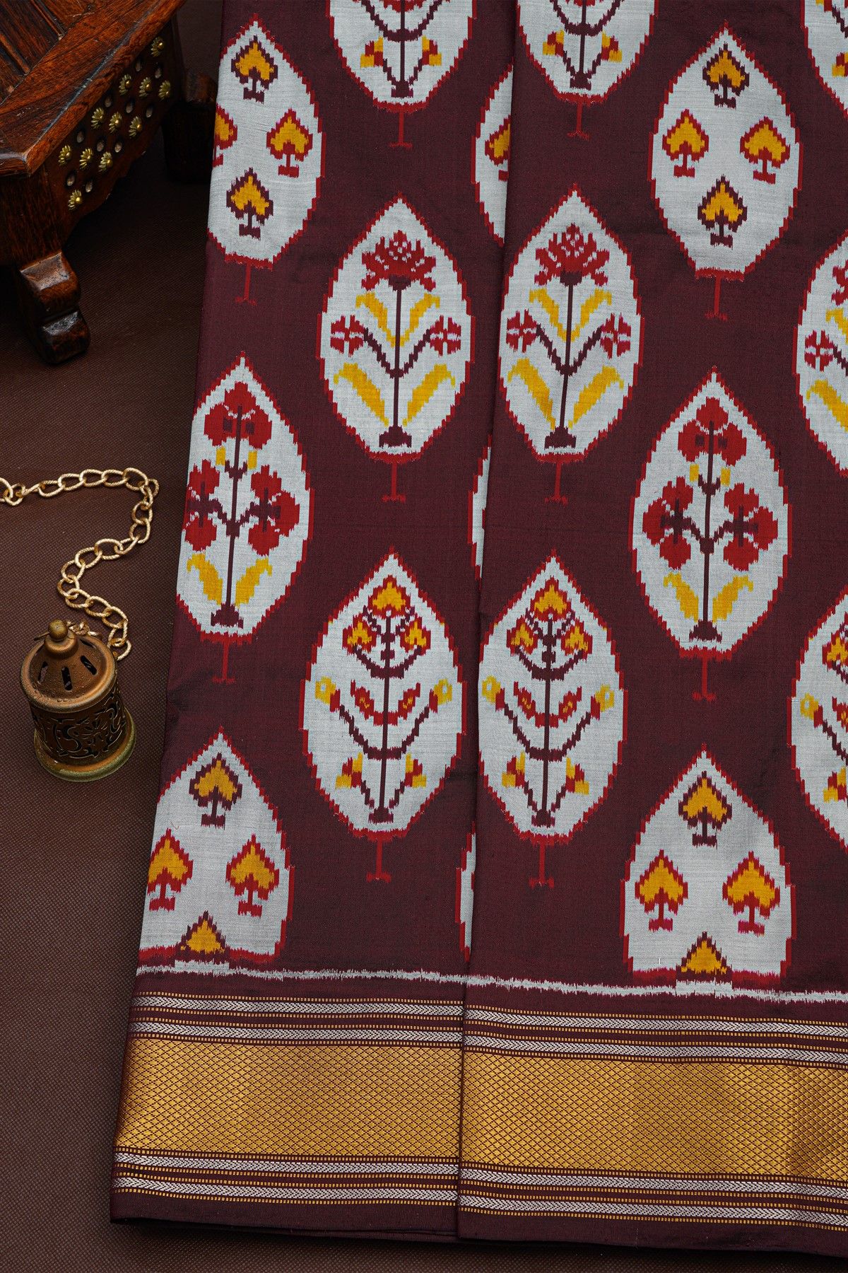Ikat Silk Dark Maroon Saree With Floral And Leaves Body