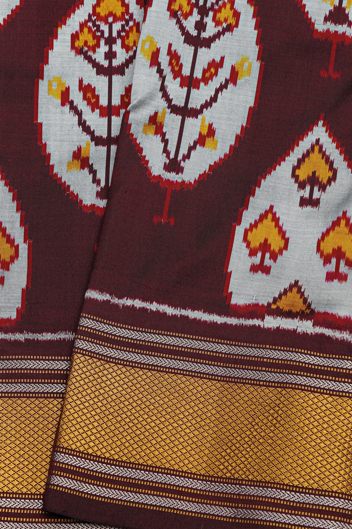 Ikat Silk Dark Maroon Saree With Floral And Leaves Body