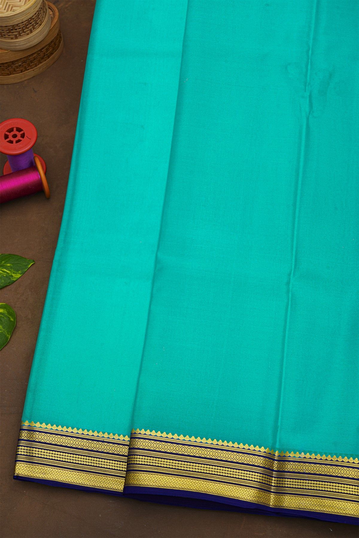 Mysore Crepe Sky Blue Saree With Florals And Zari Lines Border
