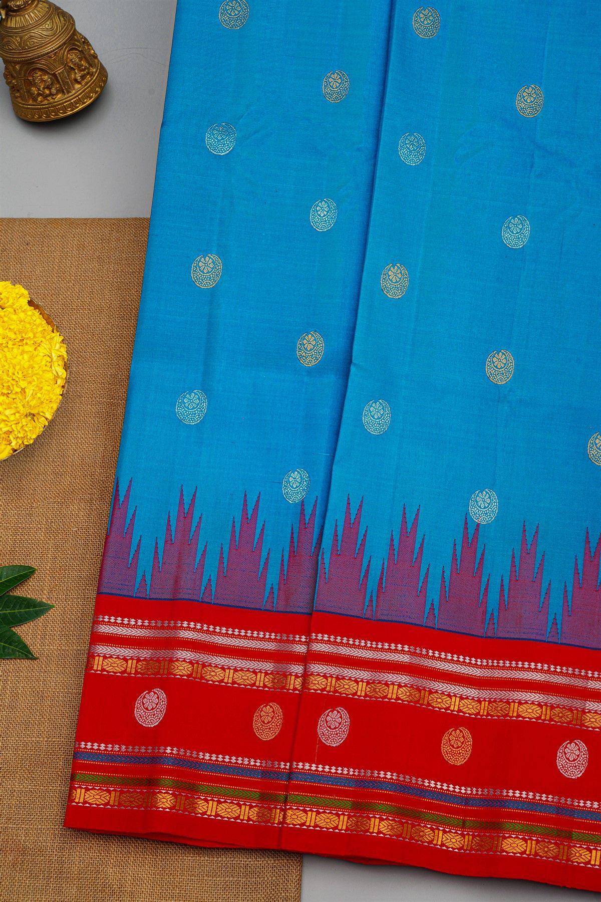 Gadwal Silk Sky Blue Saree With Florals And Buttis Border