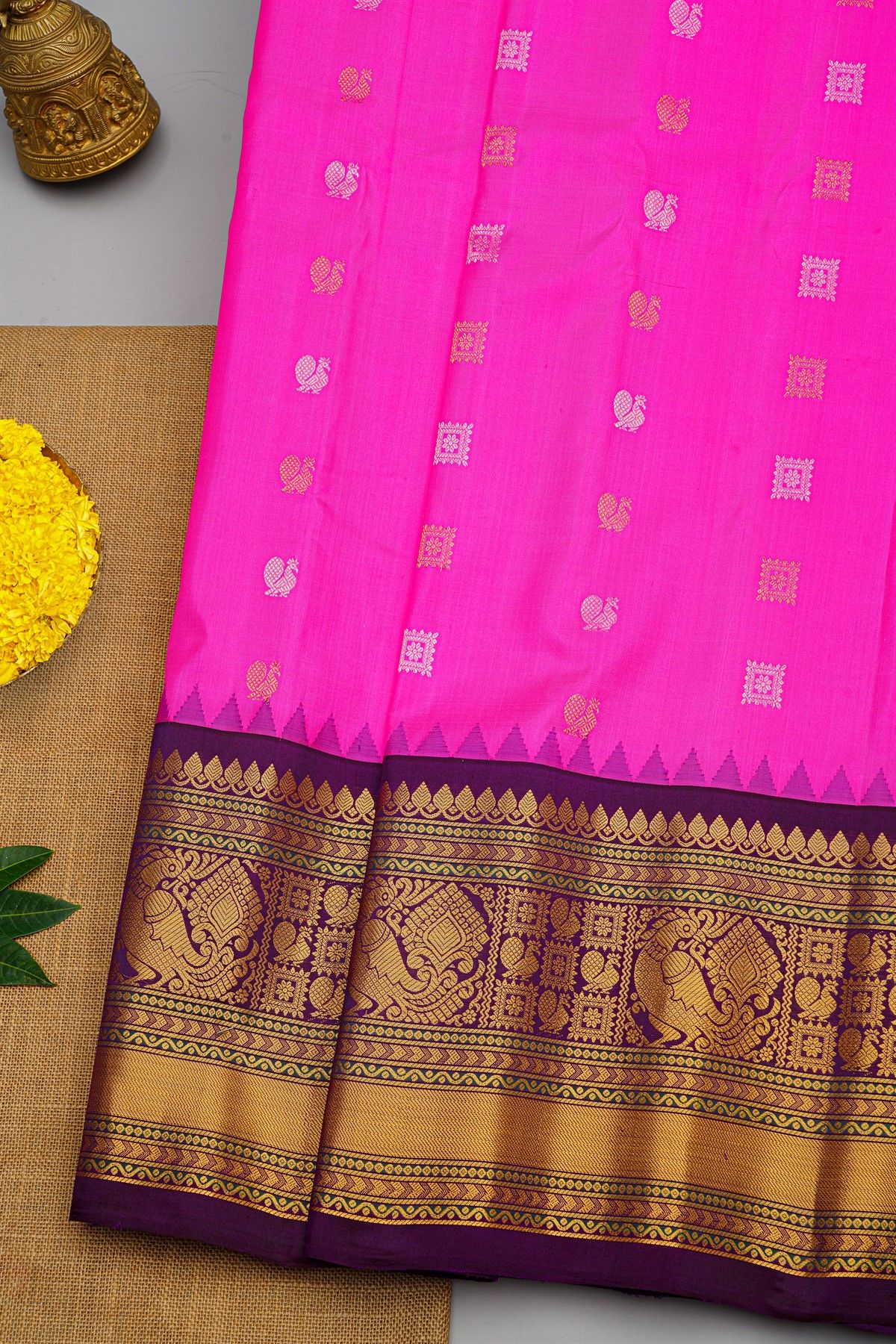 Gadwal Silk Pink Saree With Florals And Peacock Buttis Body