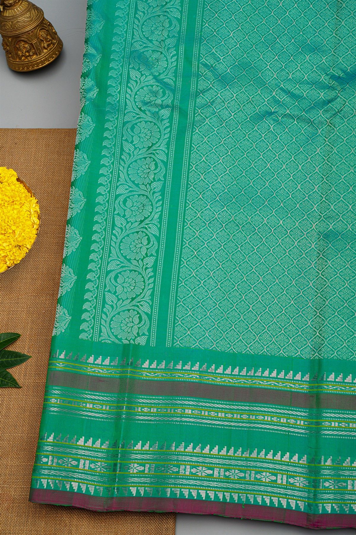 Gadwal Silk Rama Green Saree With Florals And Buttis Border