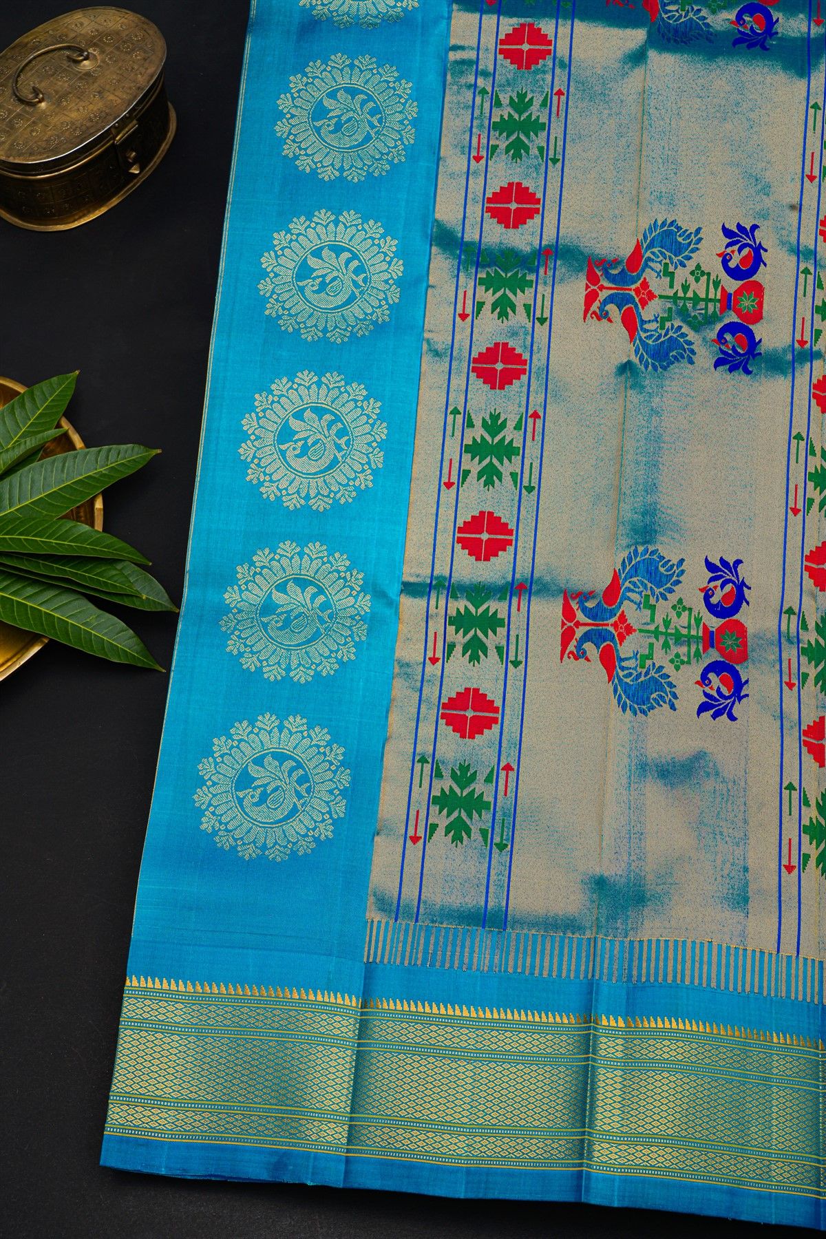 Gadwal Silk Sky Blue Saree With Florals And Peacocks In Zari Body