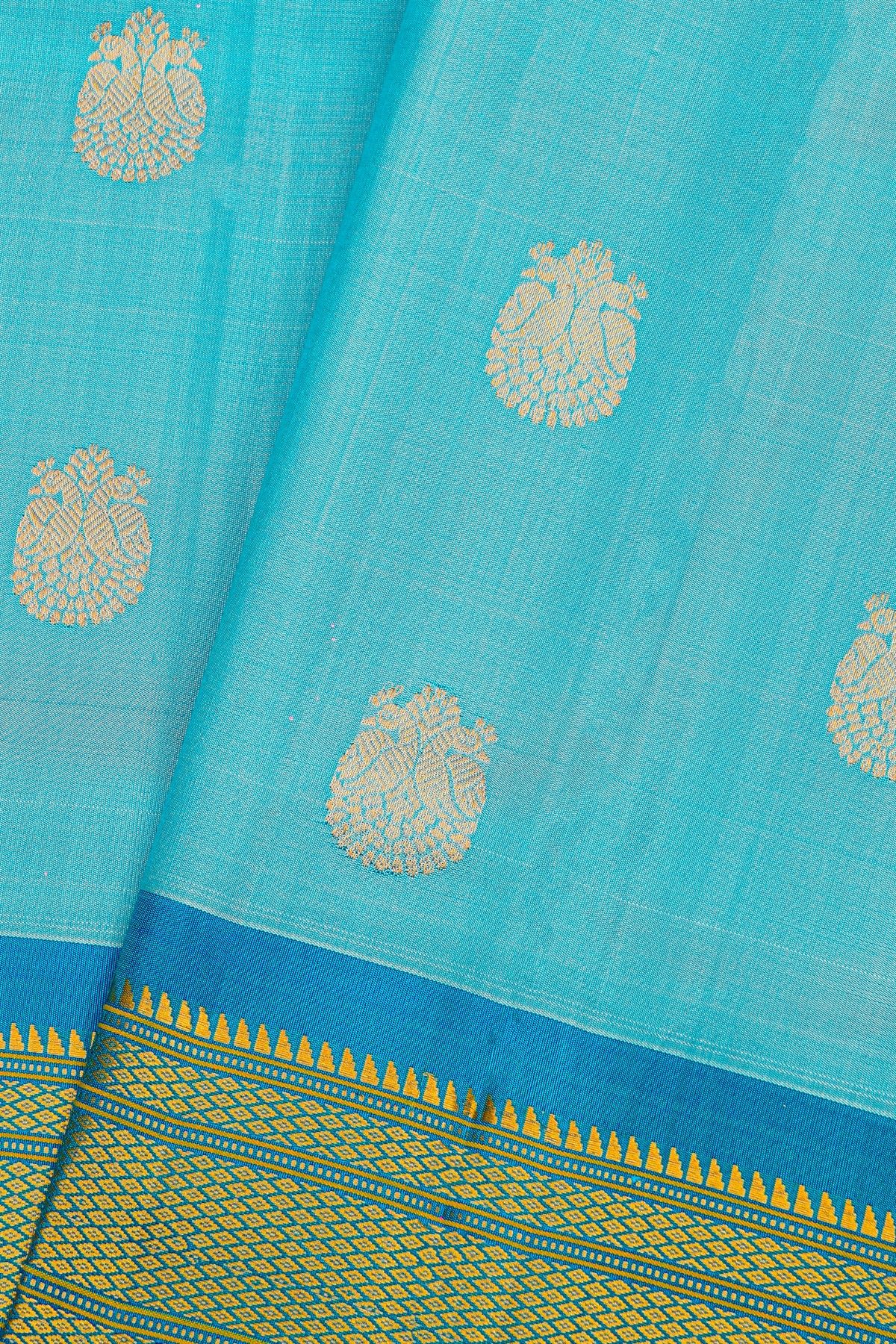 Gadwal Silk Sky Blue Saree With Florals And Peacocks In Zari Body