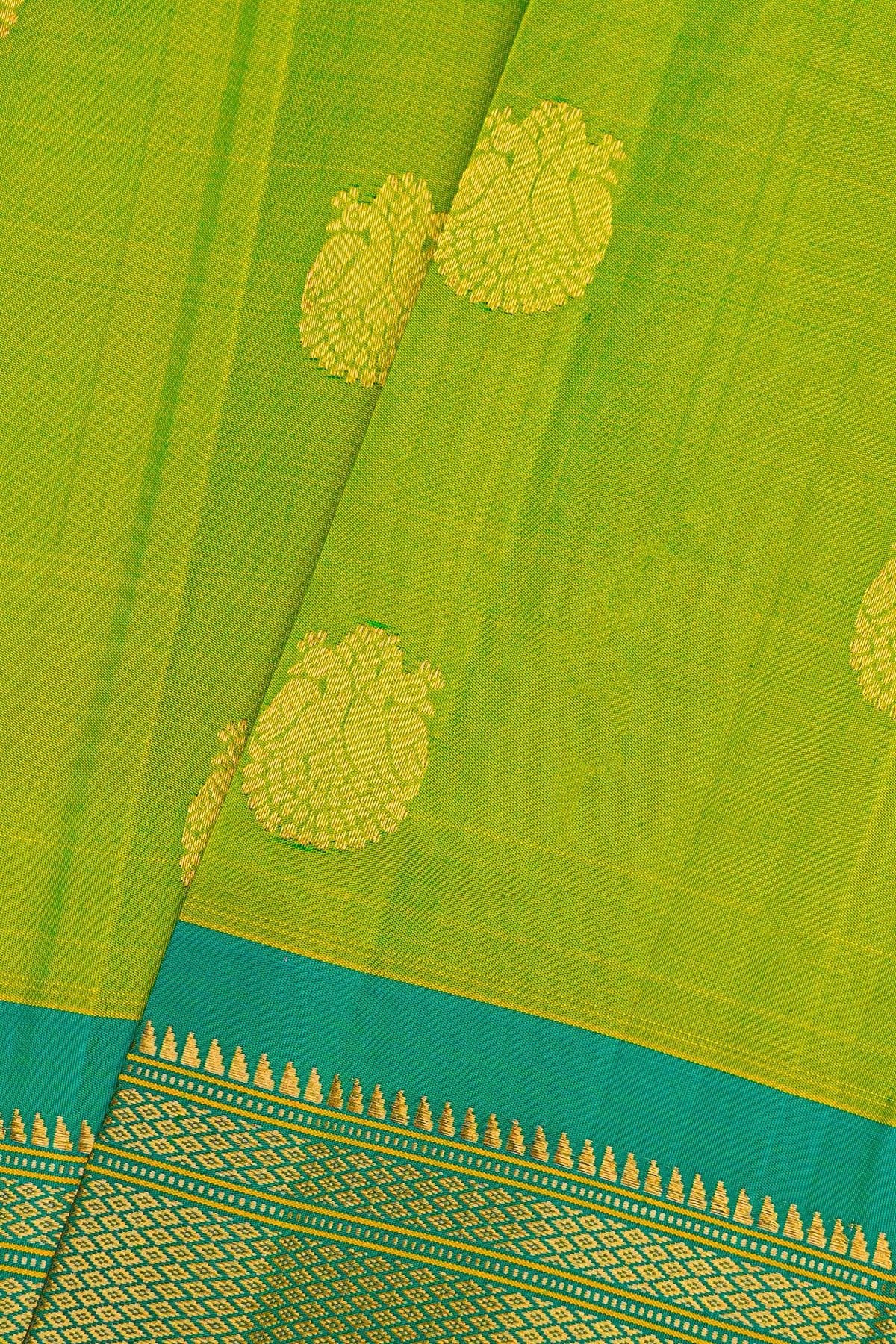 Gadwal Silk Parrot Green Saree With Florals And Peacocks In Zari Body