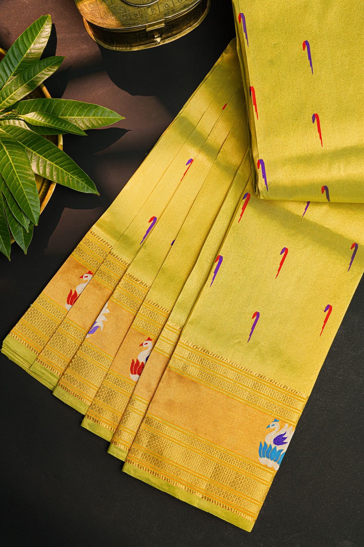 Gadwal Silk Lime Yellow Saree With Muniya Buttis Body And Swan Border