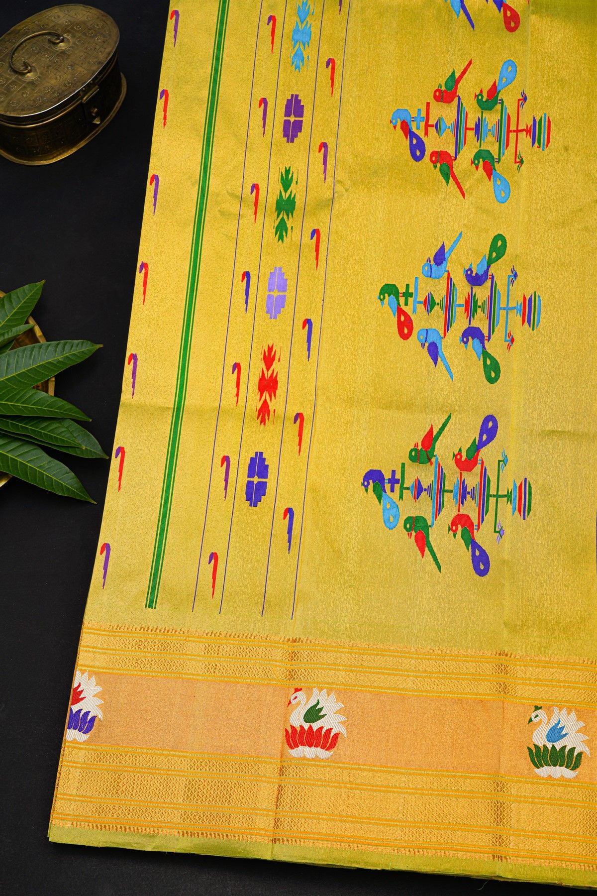 Gadwal Silk Lime Yellow Saree With Muniya Buttis Body And Swan Border