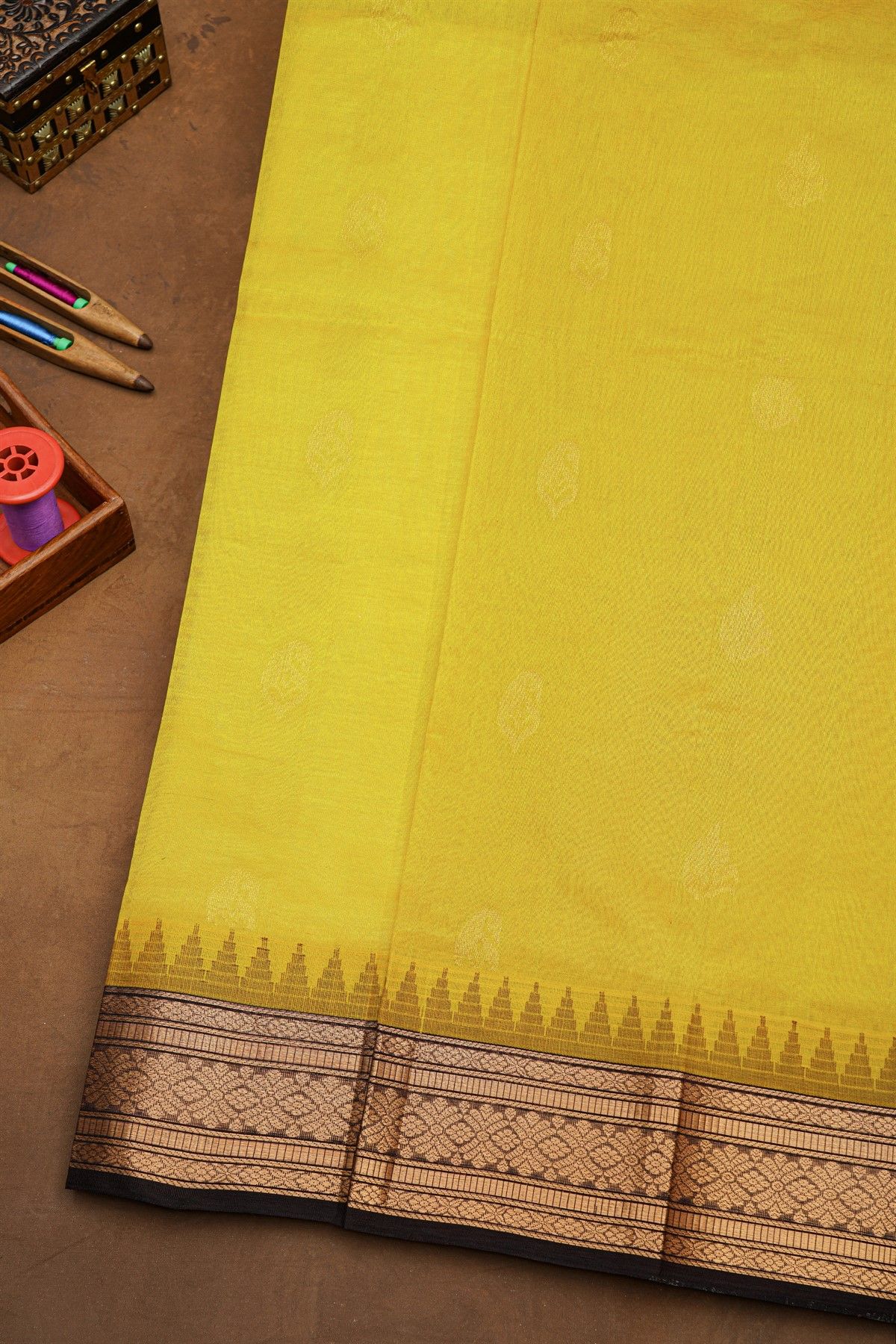 Kuppadam Sico Yellow Saree With Florals And Paisley Buttis Body