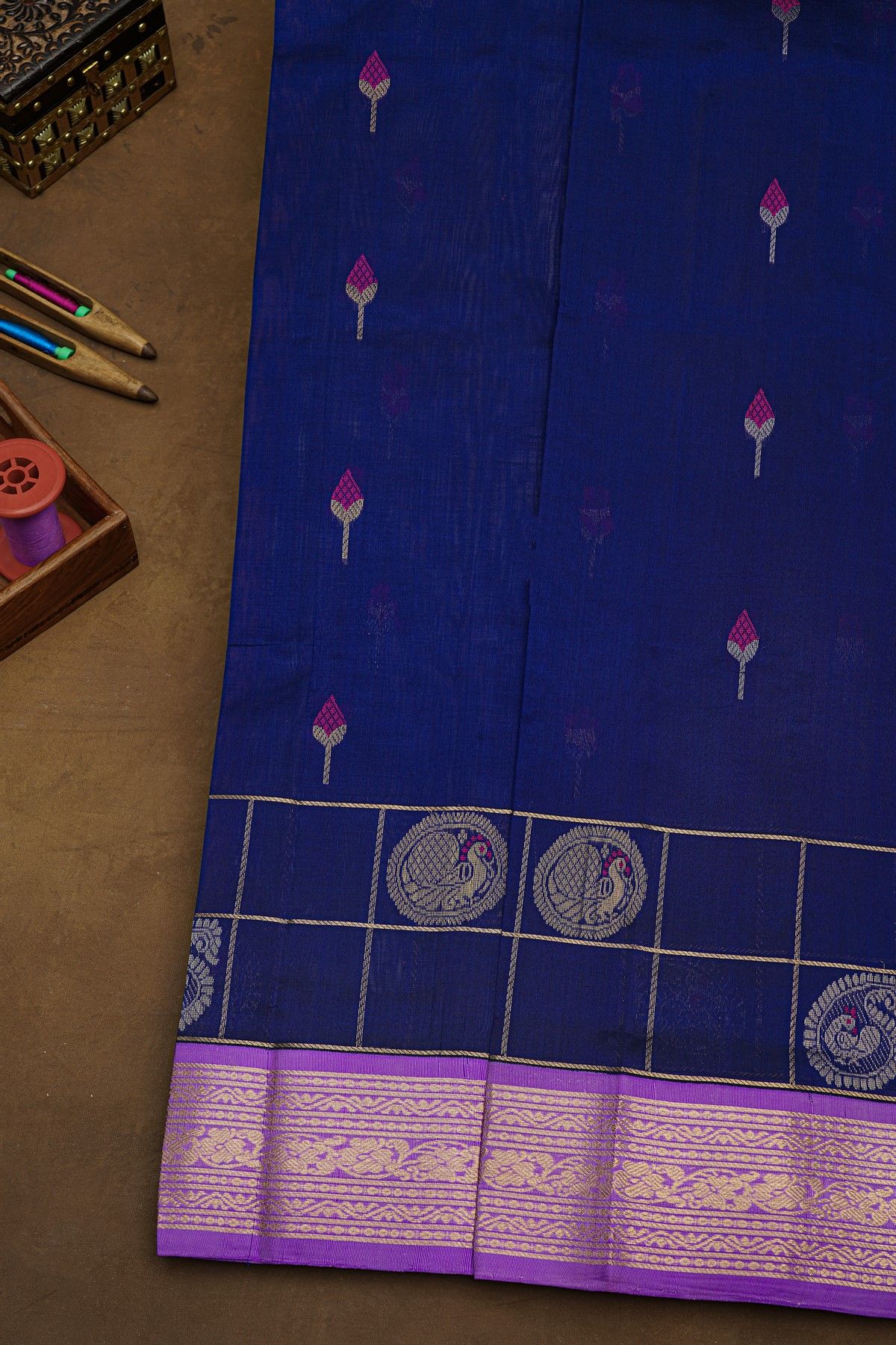 Kuppadam Sico Blue Saree With Florals And Peacock Buttis In Checks Body