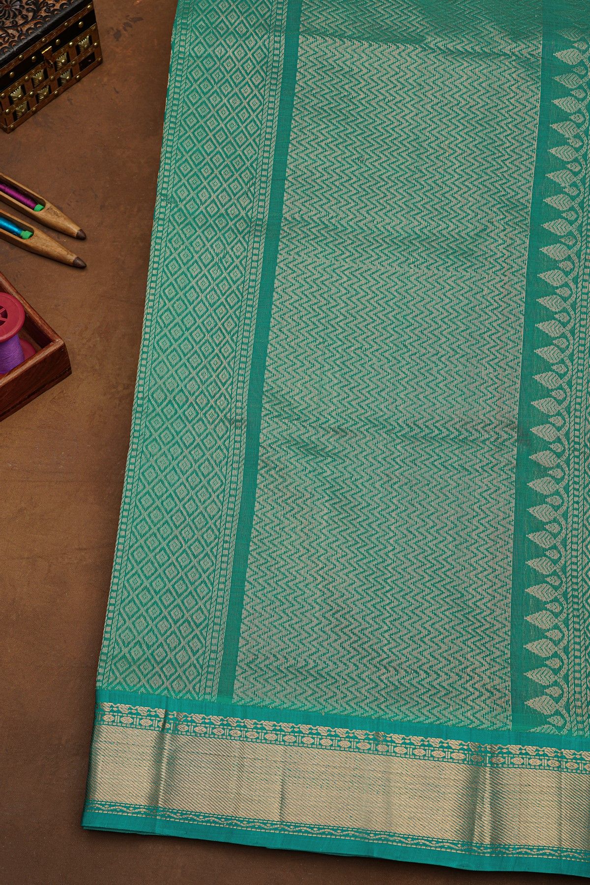 Kuppadam Sico Wine Saree With Floral And Parrot Butti Body