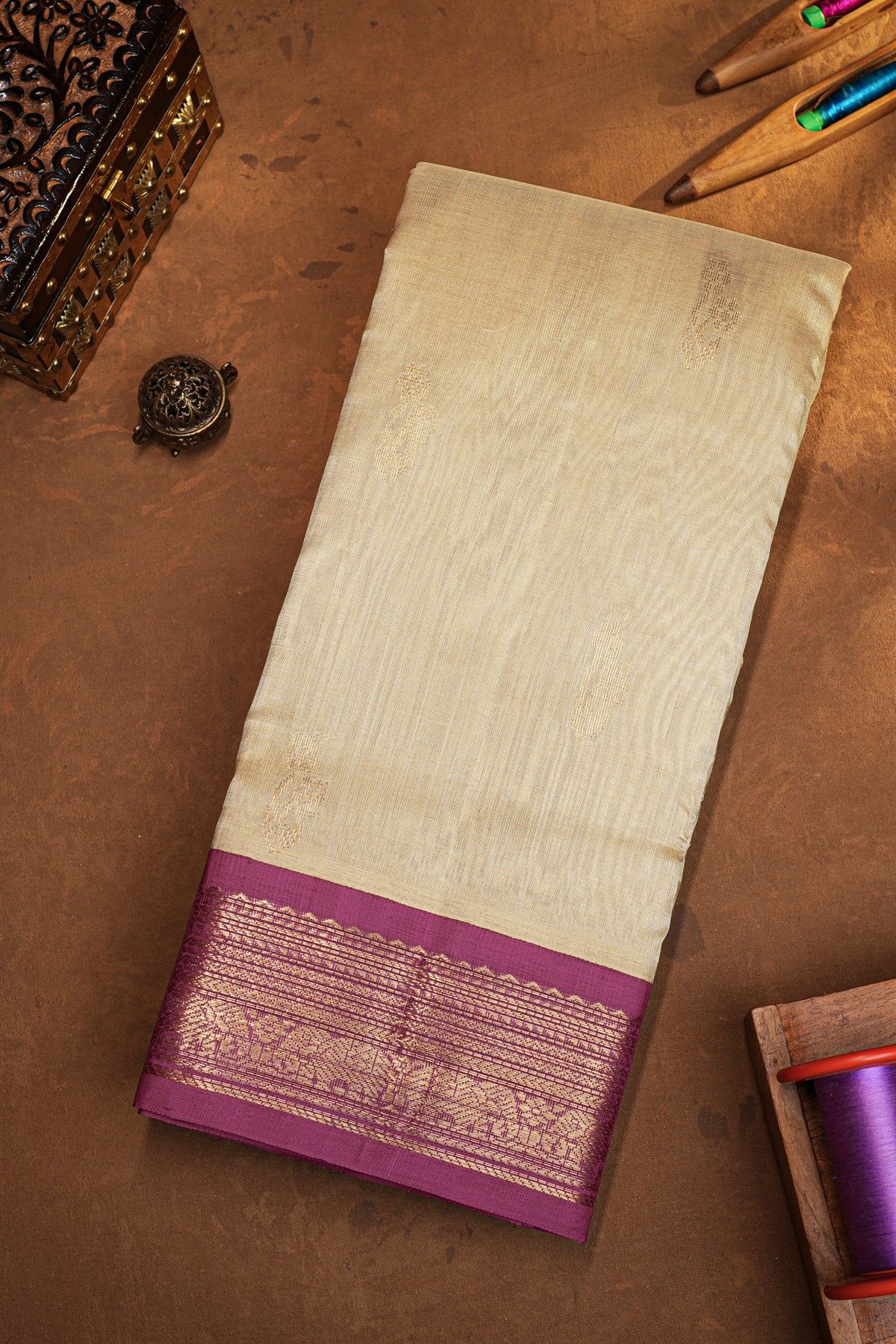Kuppadam Sico Beige Saree Showcasing Floral And Elephant Border