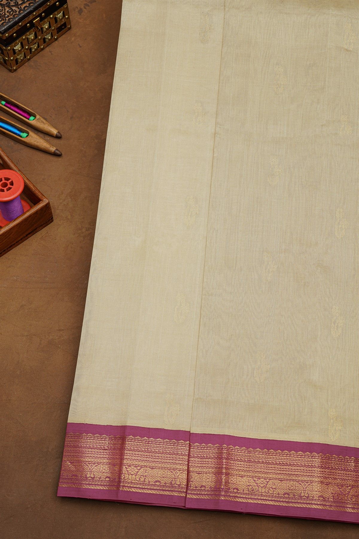 Kuppadam Sico Beige Saree Showcasing Floral And Elephant Border