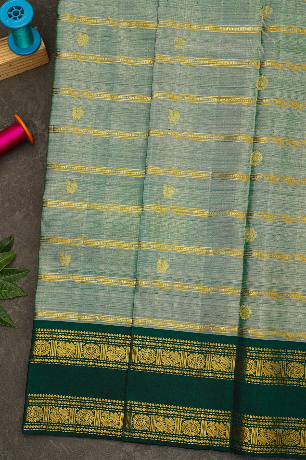 Kancheepuram Silk Sea Green Saree With Zari Lines And Peacock Buttis Body