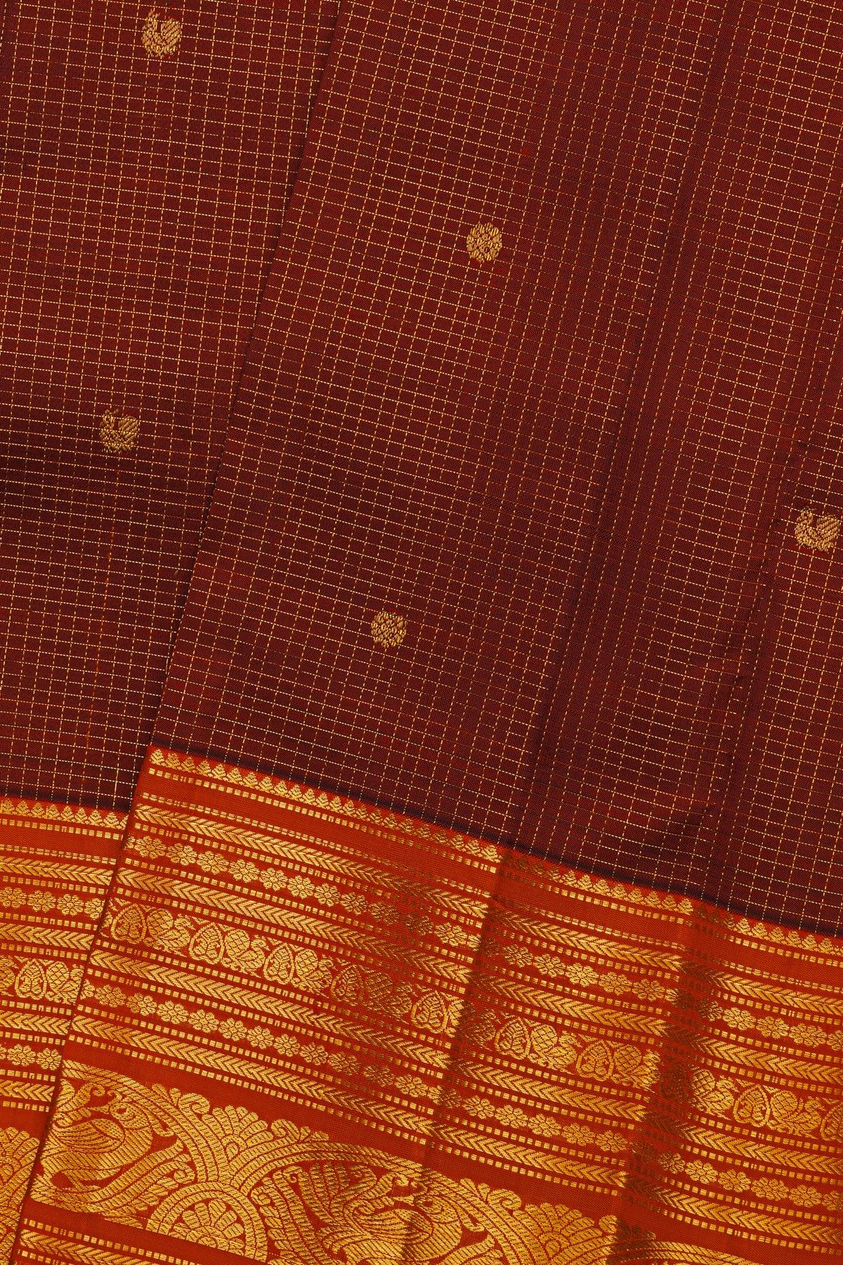 Kancheepuram Silk Maroon Saree With Zari Checks Florals And Peacock Buttis Body