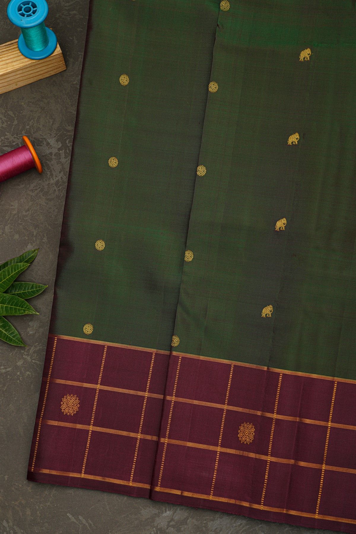 Kancheepuram Silk Bottle Green Saree With Floral And Elephant Buttis Body
