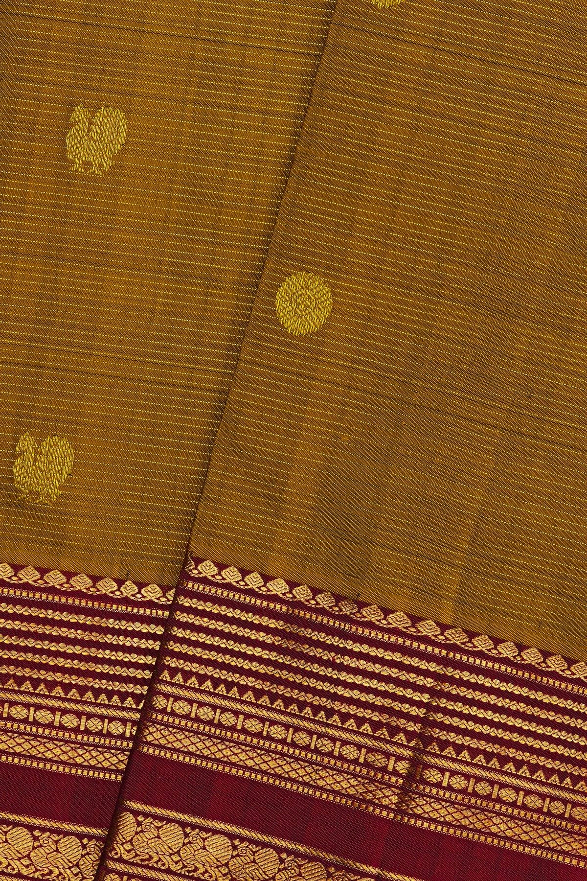 Kancheepuram Silk Mustard Yellow Saree With Zari Lines And Peacocks Buttis Body