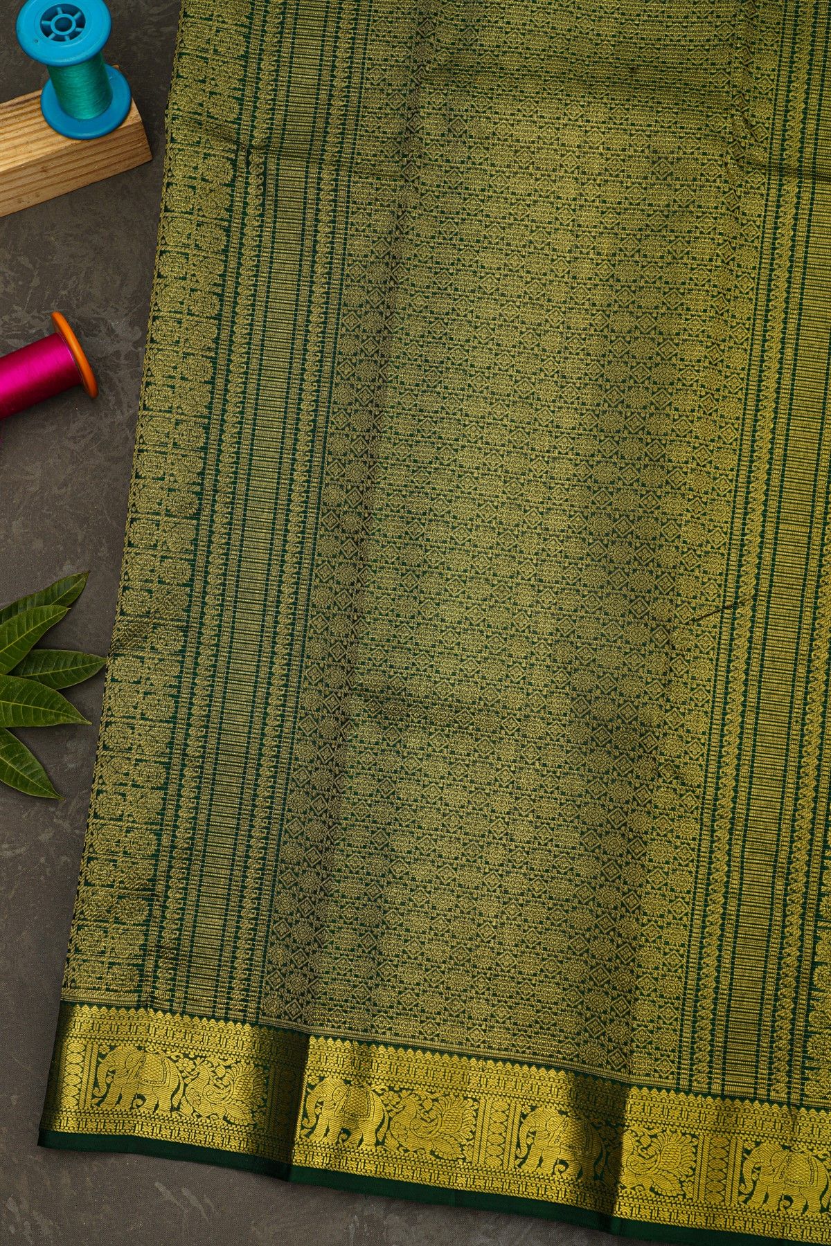 Kancheepuram Silk Bottle Green Saree With Zari Lines Checks Florals And Peacock Buttis Body