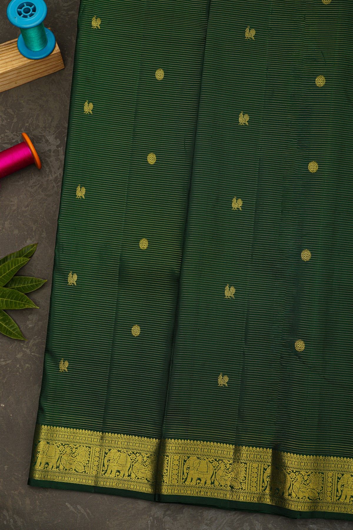 Kancheepuram Silk Bottle Green Saree With Zari Lines And Buttis Body