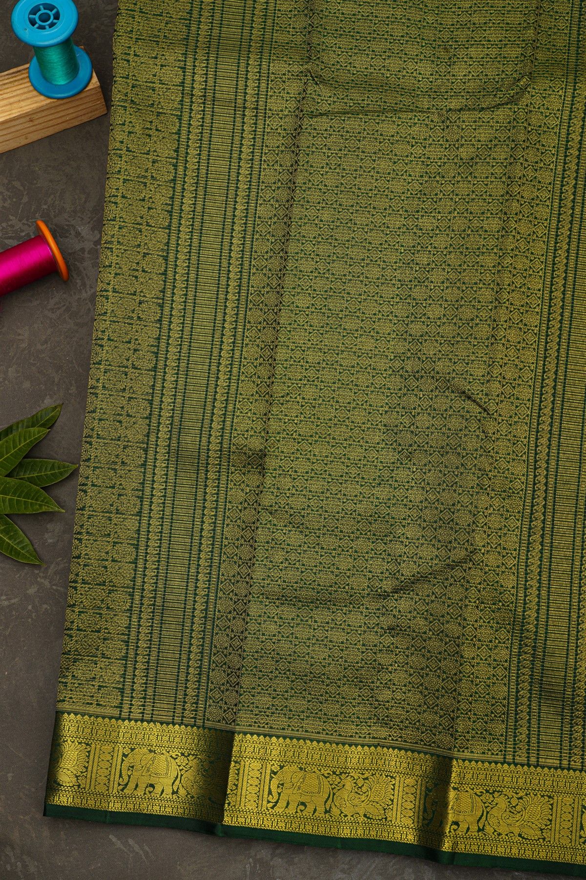 Kancheepuram Silk Bottle Green Saree With Zari Lines And Buttis Body