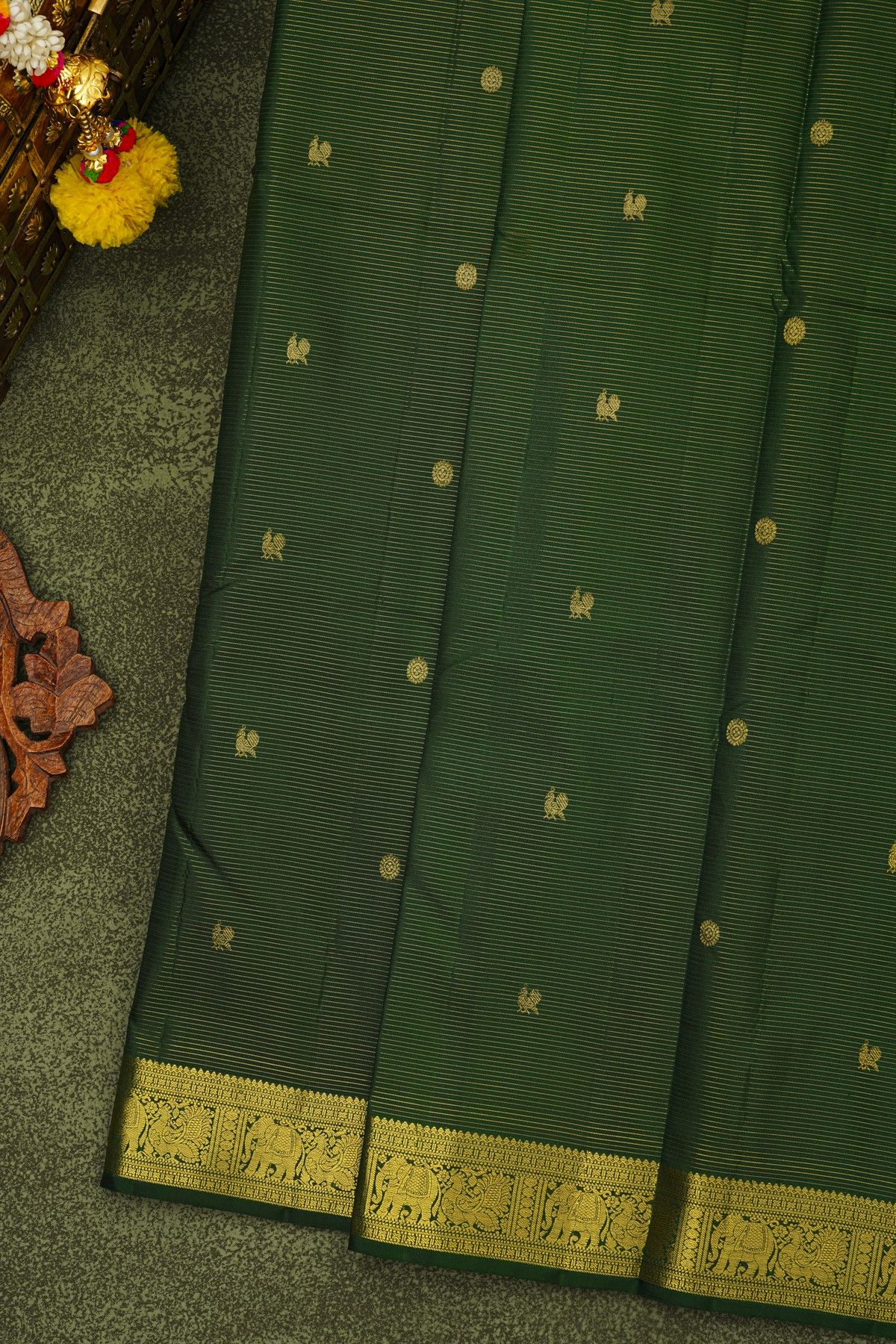 Kancheepuram Silk Bottle Green Saree With Zari Lines And Floral Peacock Buttis Body