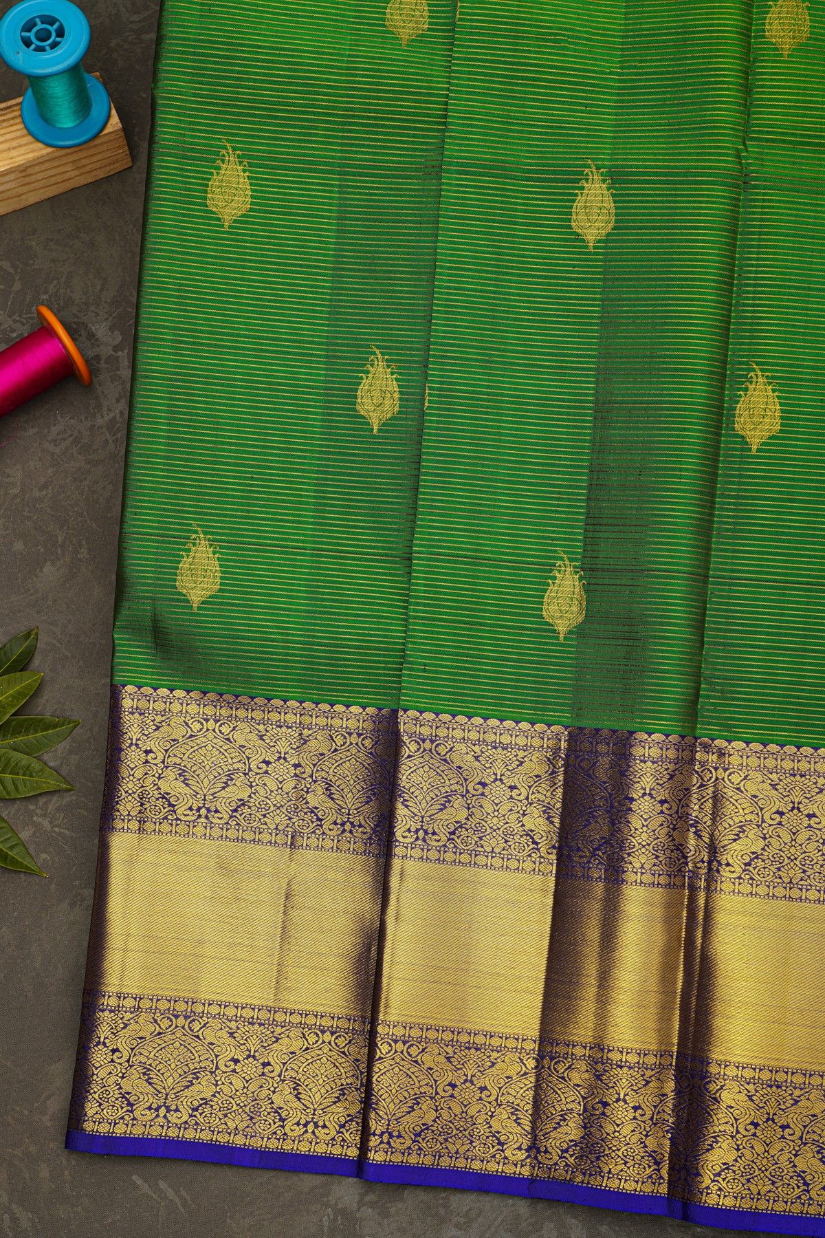 Kancheepuram Silk Leaf Green Saree With Florals And Peacock Border