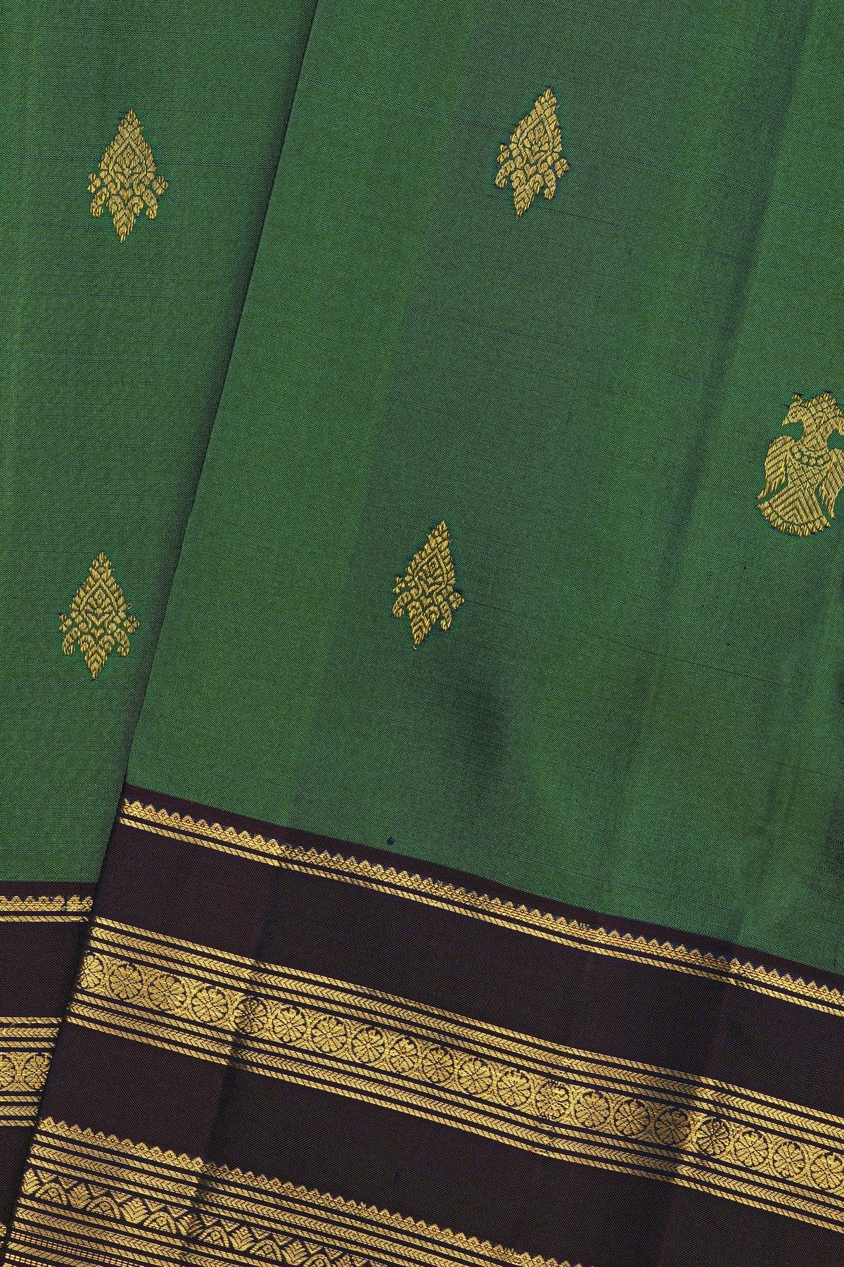 Kancheepuram Silk Bottle Green Saree With Florals And Gandaberunda Buttis Body