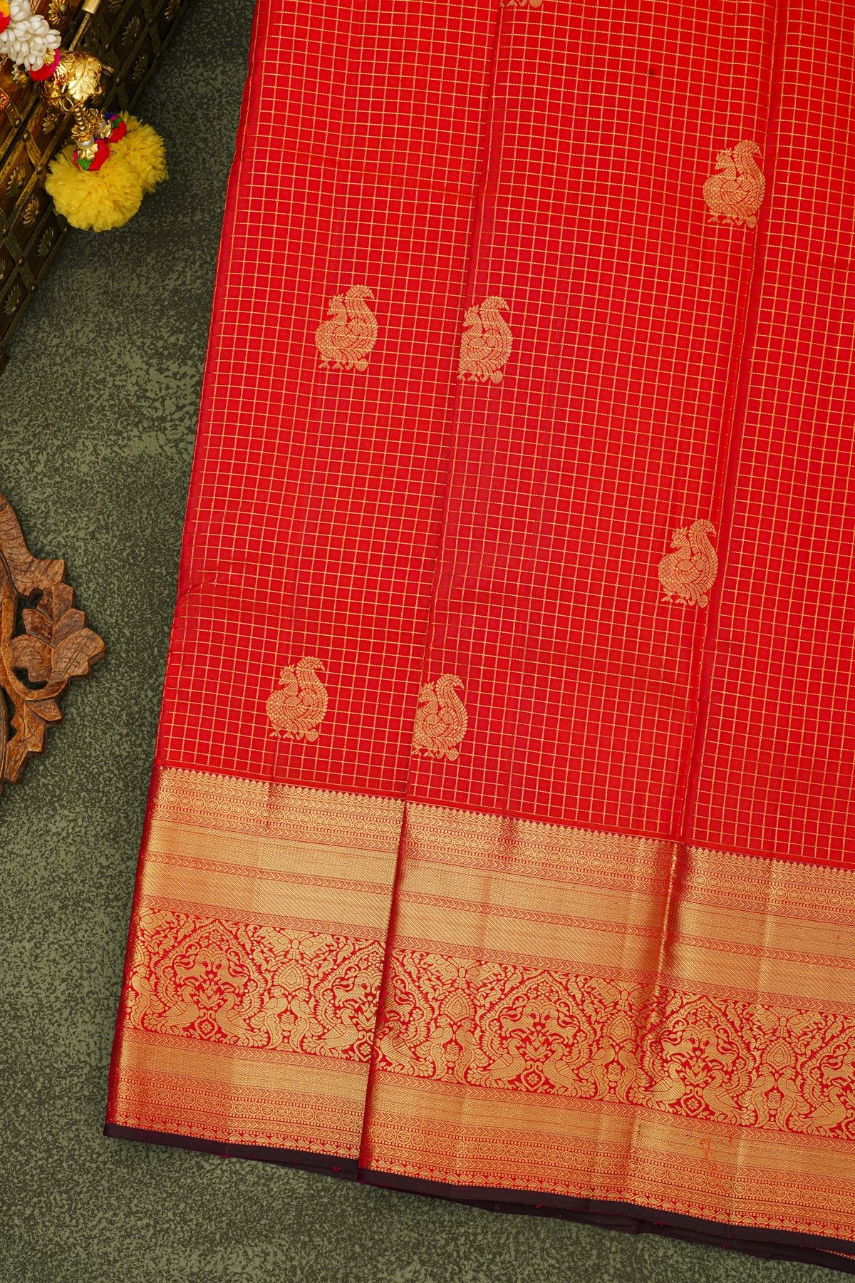 Kancheepuram Silk Red Saree With Zari Checks And Peacock Buttis Body