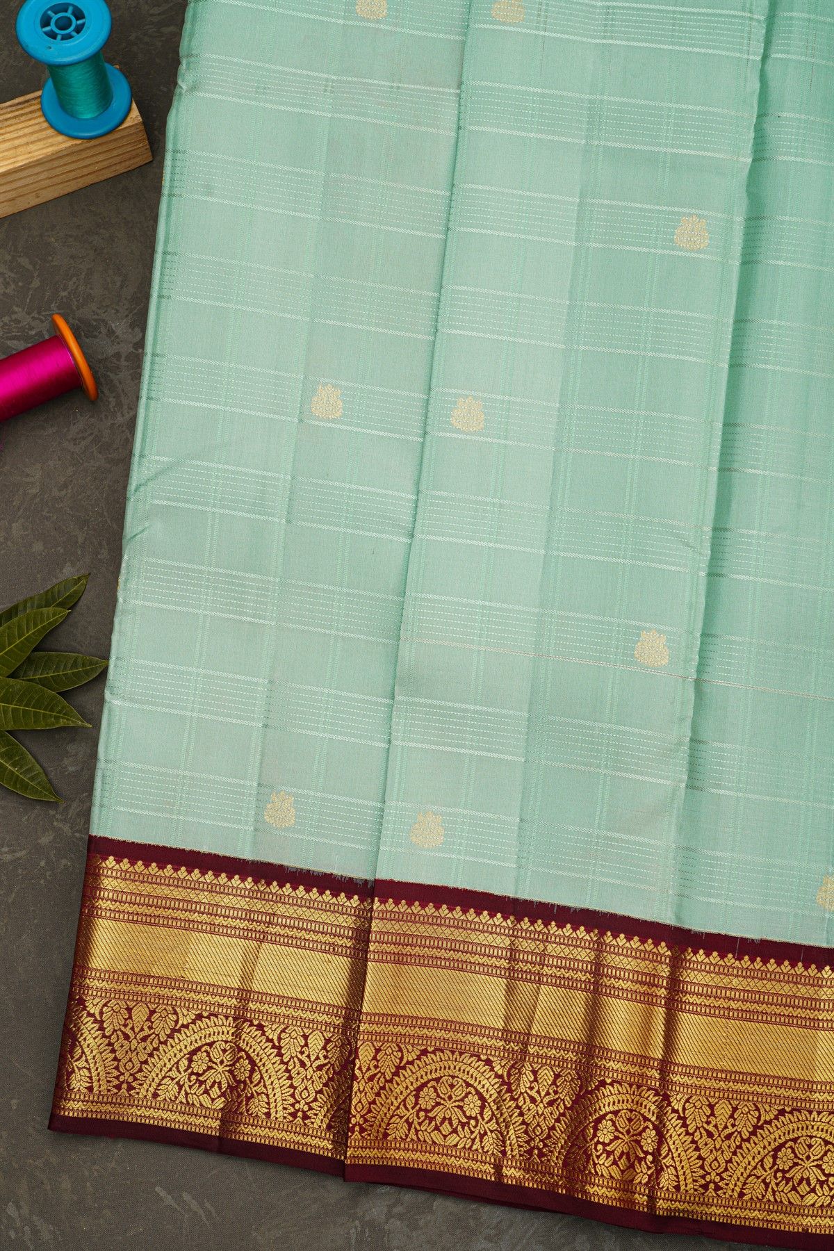 Kancheepuram Silk Sea Green Saree With Peacock Buttis In Zari Checks Body