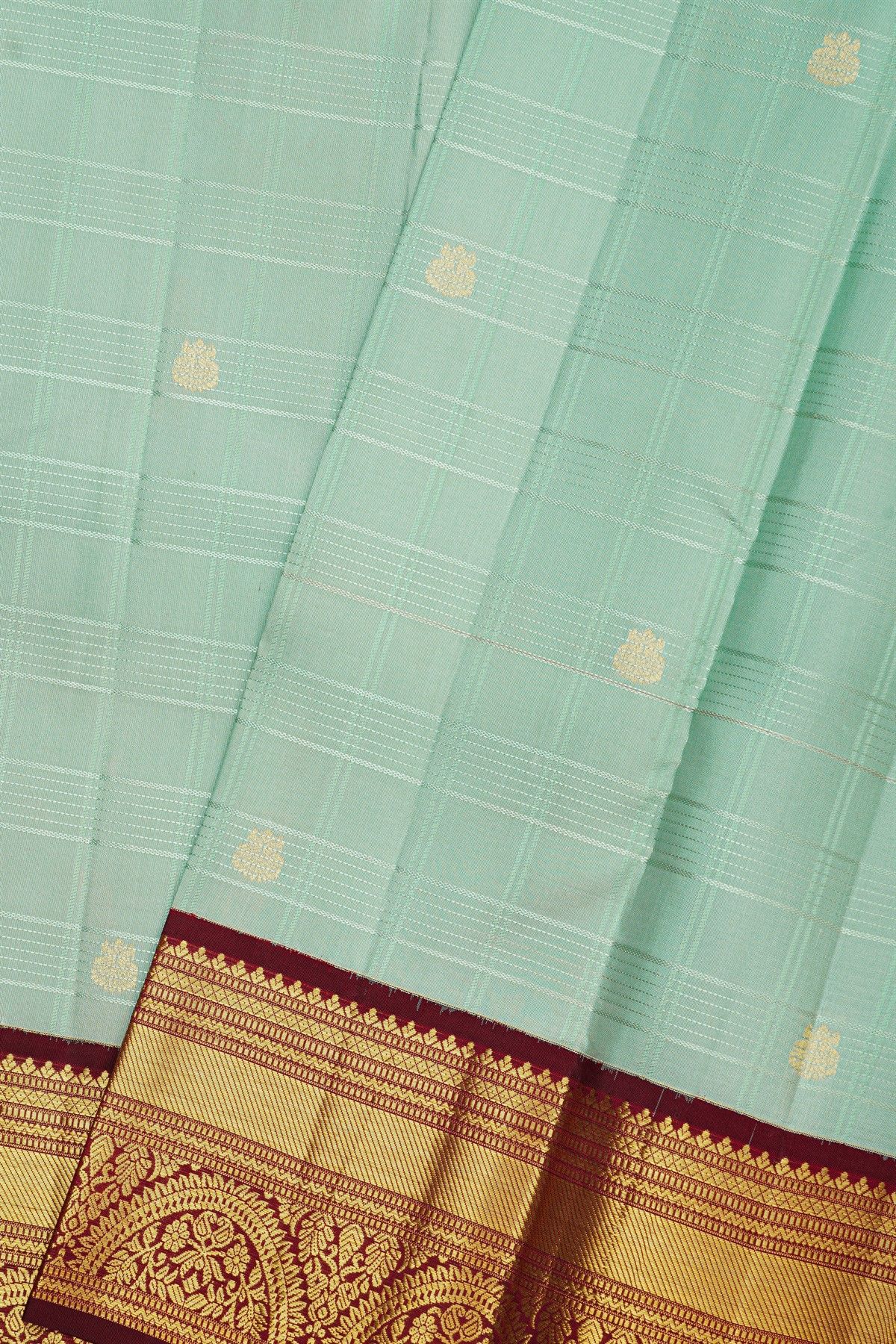 Kancheepuram Silk Sea Green Saree With Peacock Buttis In Zari Checks Body