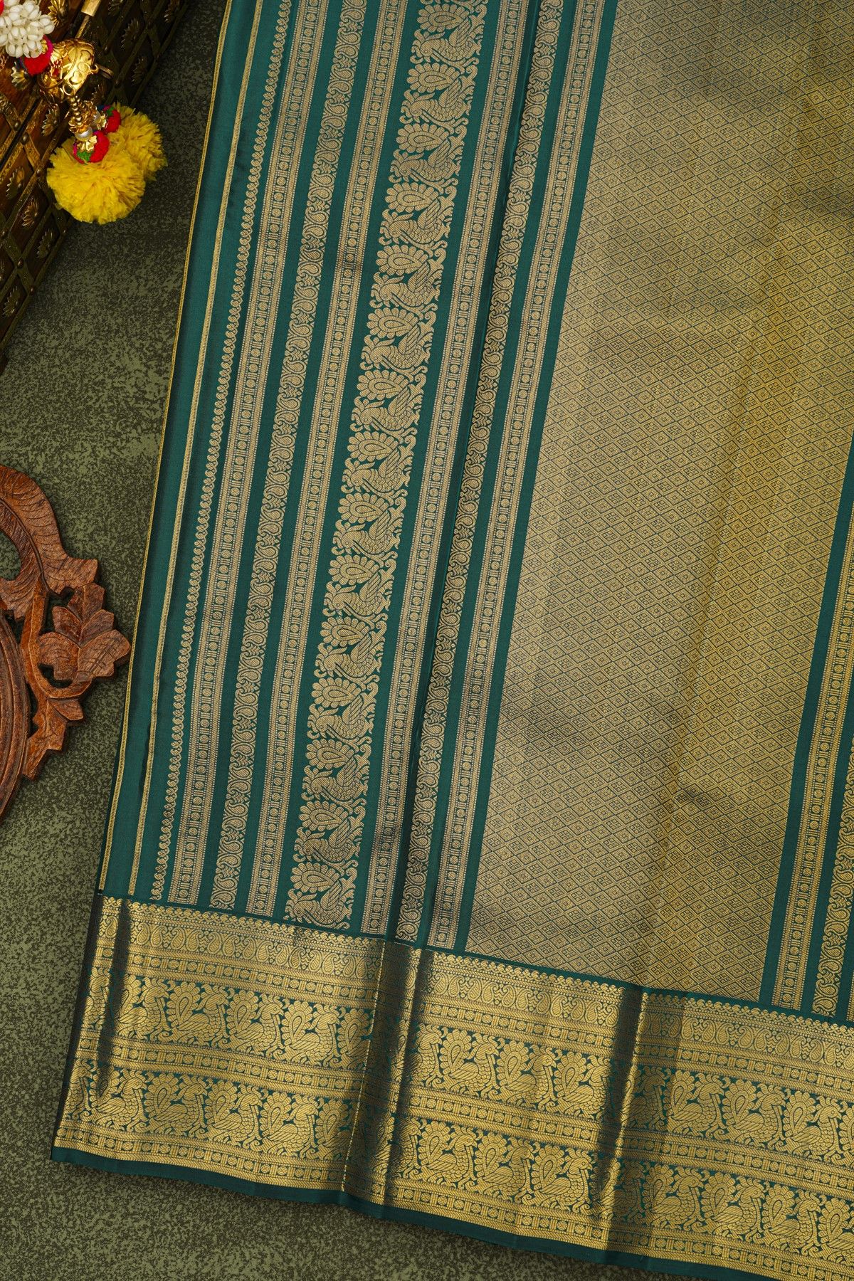 Kancheepuram Silk Bottle Green Saree With Zari Lines And Peacocks Border