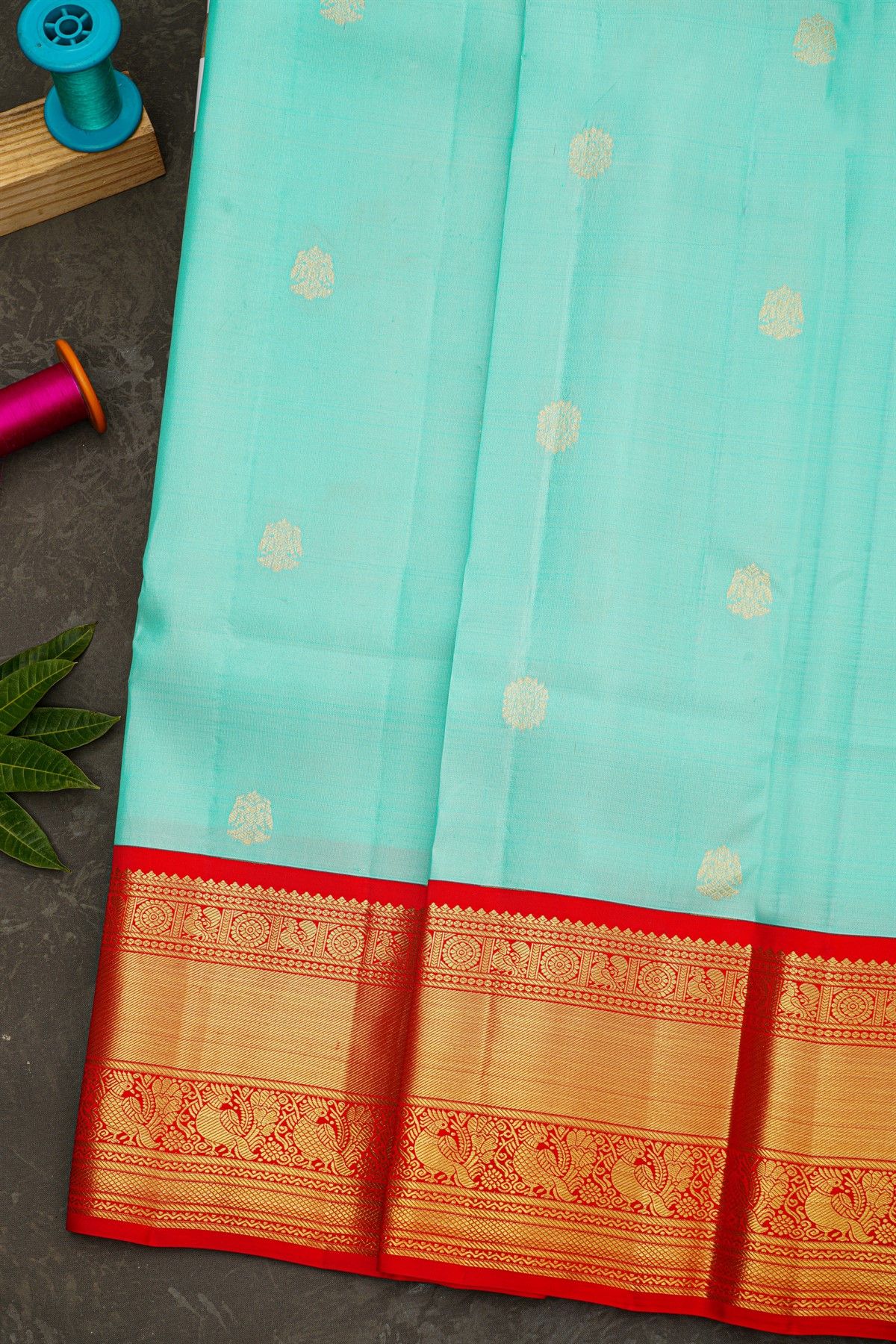 Kancheepuram Silk Sky Blue Saree With Rudraksha Buttis Body And Traditional Border