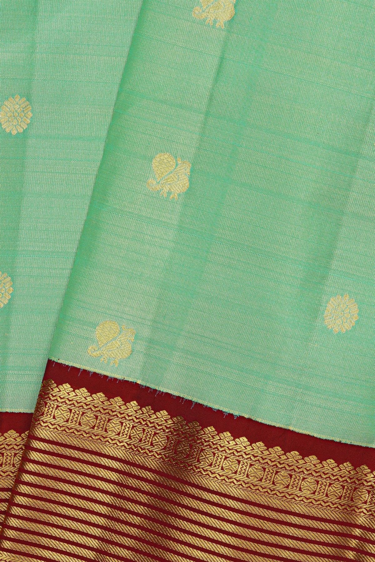 Kancheepuram Silk Sea Green Saree With Zari Lines And Peacocks Border