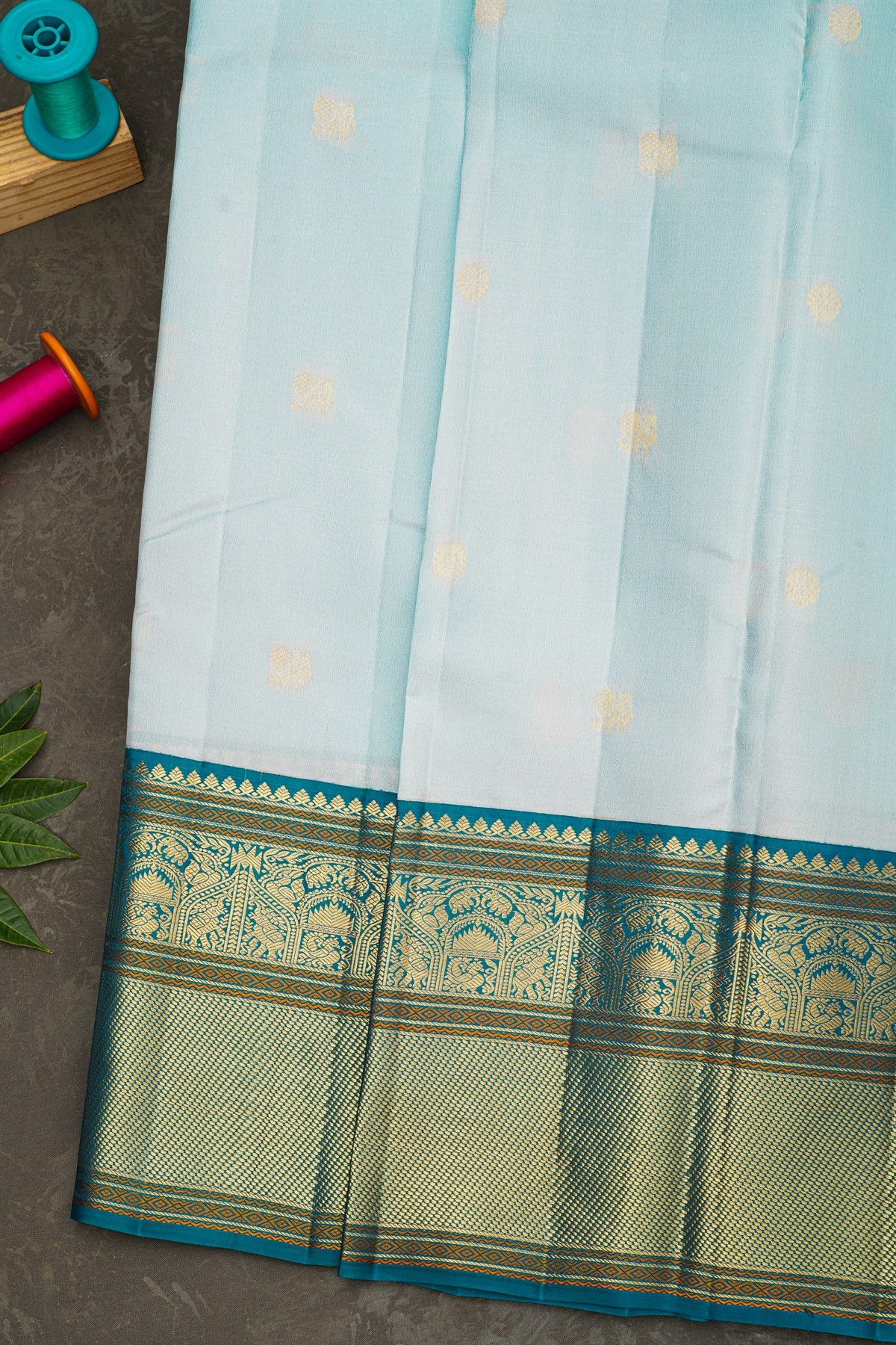 Kancheepuram Silk Sky Blue Saree With Florals And Peacock Buttis Body