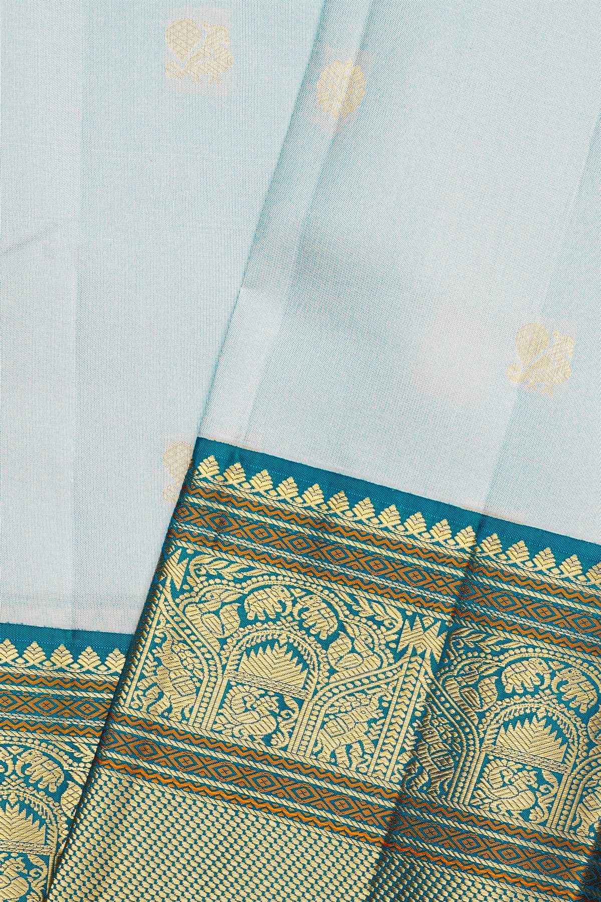 Kancheepuram Silk Sky Blue Saree With Florals And Peacock Buttis Body
