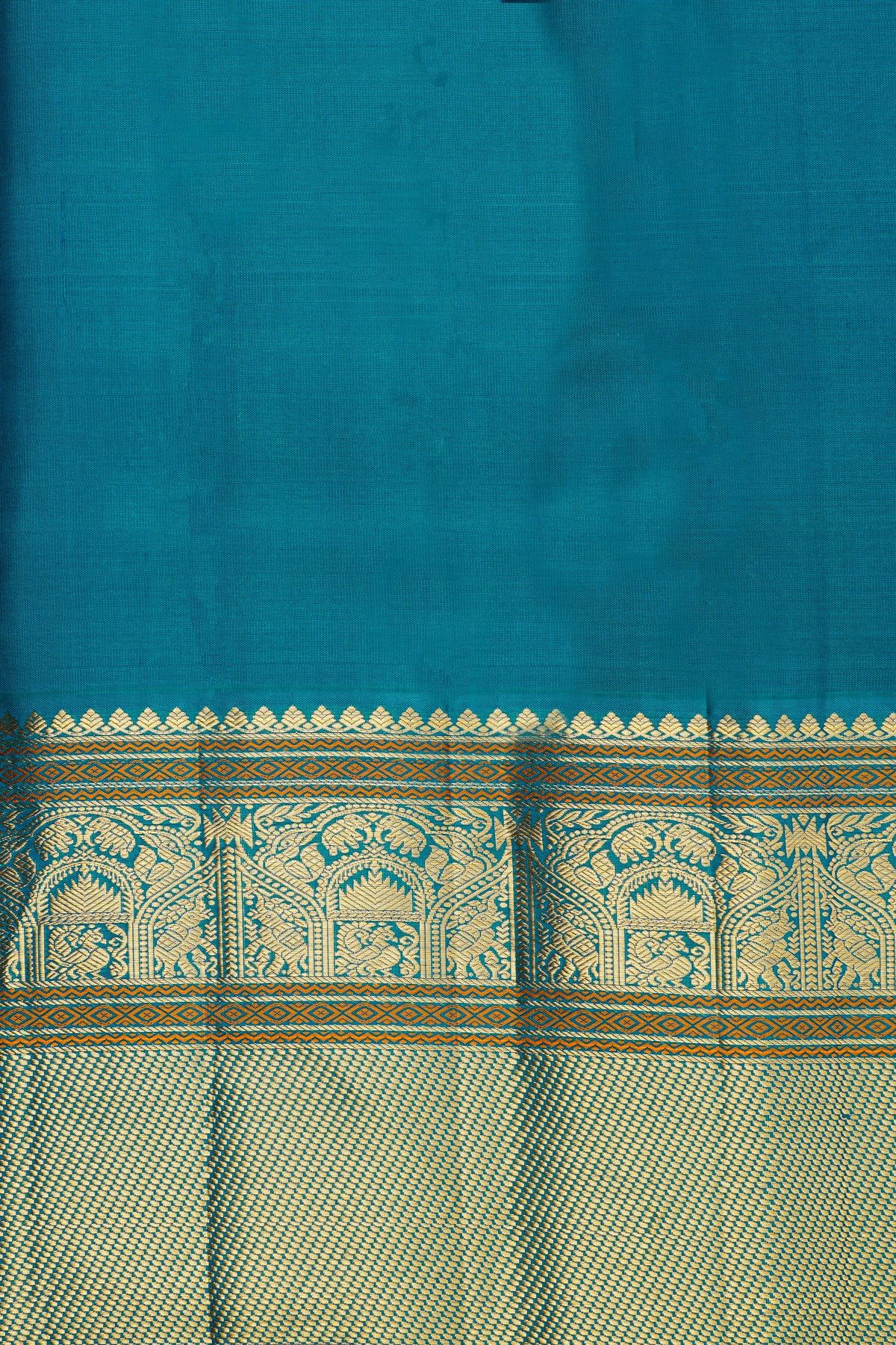 Kancheepuram Silk Sky Blue Saree With Florals And Peacock Buttis Body