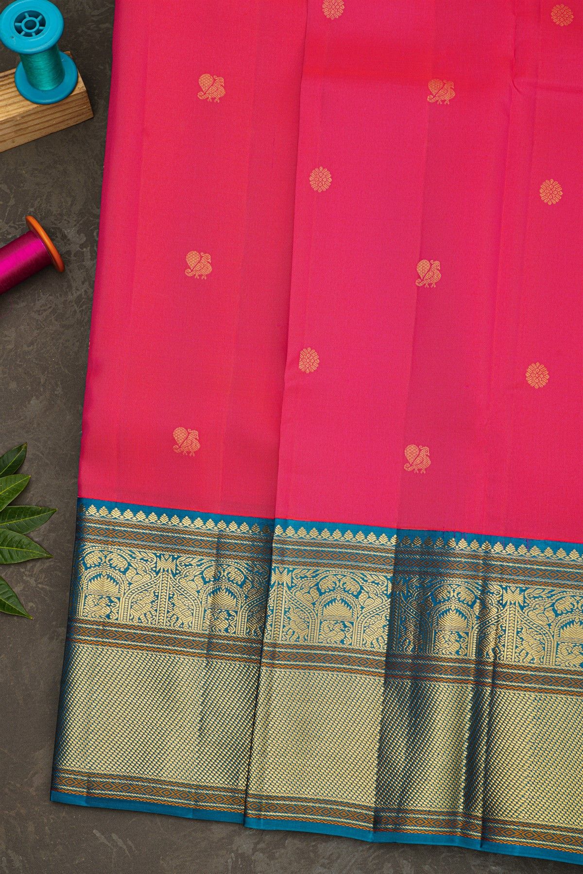 Kancheepuram Silk Rani Pink Saree With Florals And Peacock Buttis Body And Kuttu Border