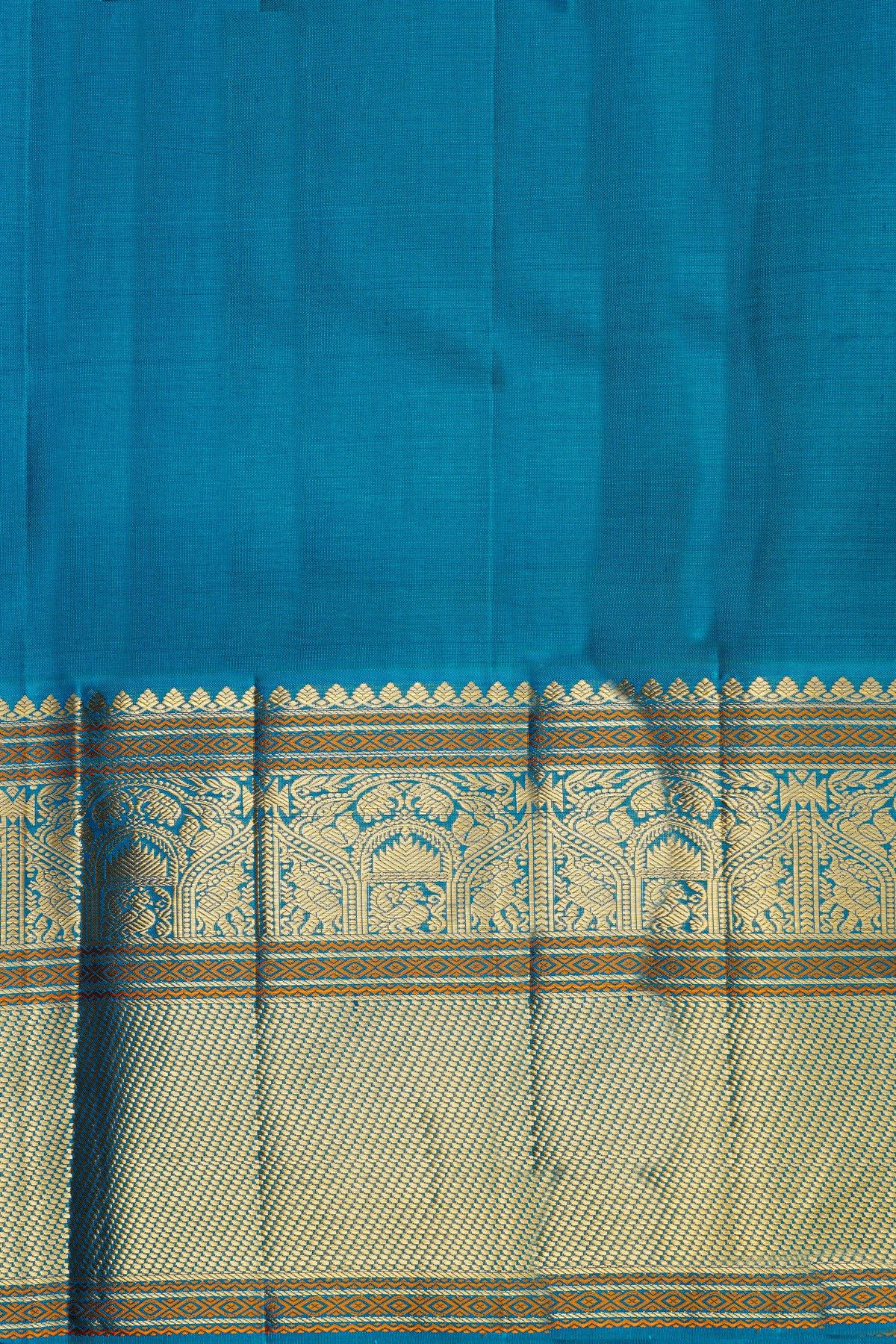 Kancheepuram Silk Rani Pink Saree With Florals And Peacock Buttis Body And Kuttu Border